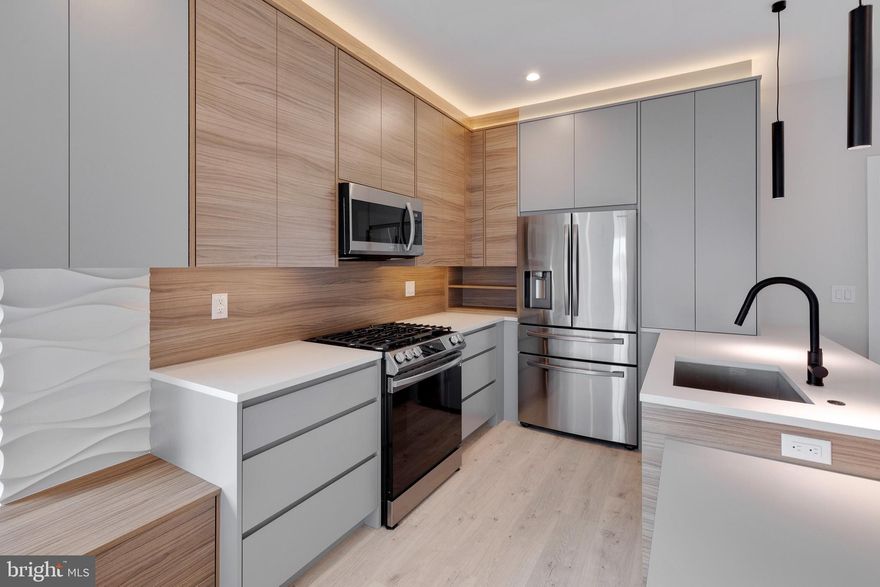 Welcome to 1601 S. 22nd, a 2 year old LUXURY 2 bed, 2.5 bath apartment in prime Point Breeze location now available for rent! ROOFDECK w/ spectacular city skyline views!! At about 900 square feet, this unit features top of the line finishes, high end appliances and because it's on a corner, you have extra windows that bring in a ton of sunlight! This unit also has an extra massive living space on the lower level. This apartment boasts hardwood flooring throughout, has 9 foot ceilings, modern kitchen w/ stainless steel appliances including a dishwasher, quartz counter tops, slow closing cabinets and a gorgeous backsplash w/ a breakfast bar. For convenience this apartment also included a washer and dryer in unit! All bedrooms feature hardwood flooring, large closets and recessed lighting. Full bathrooms with beautiful tile throughout, shower and vanity. Prime location with easy access to restaurants, shopping, schools, public transportation and much more and close to I-76 and I-95! Schedule your showing today!