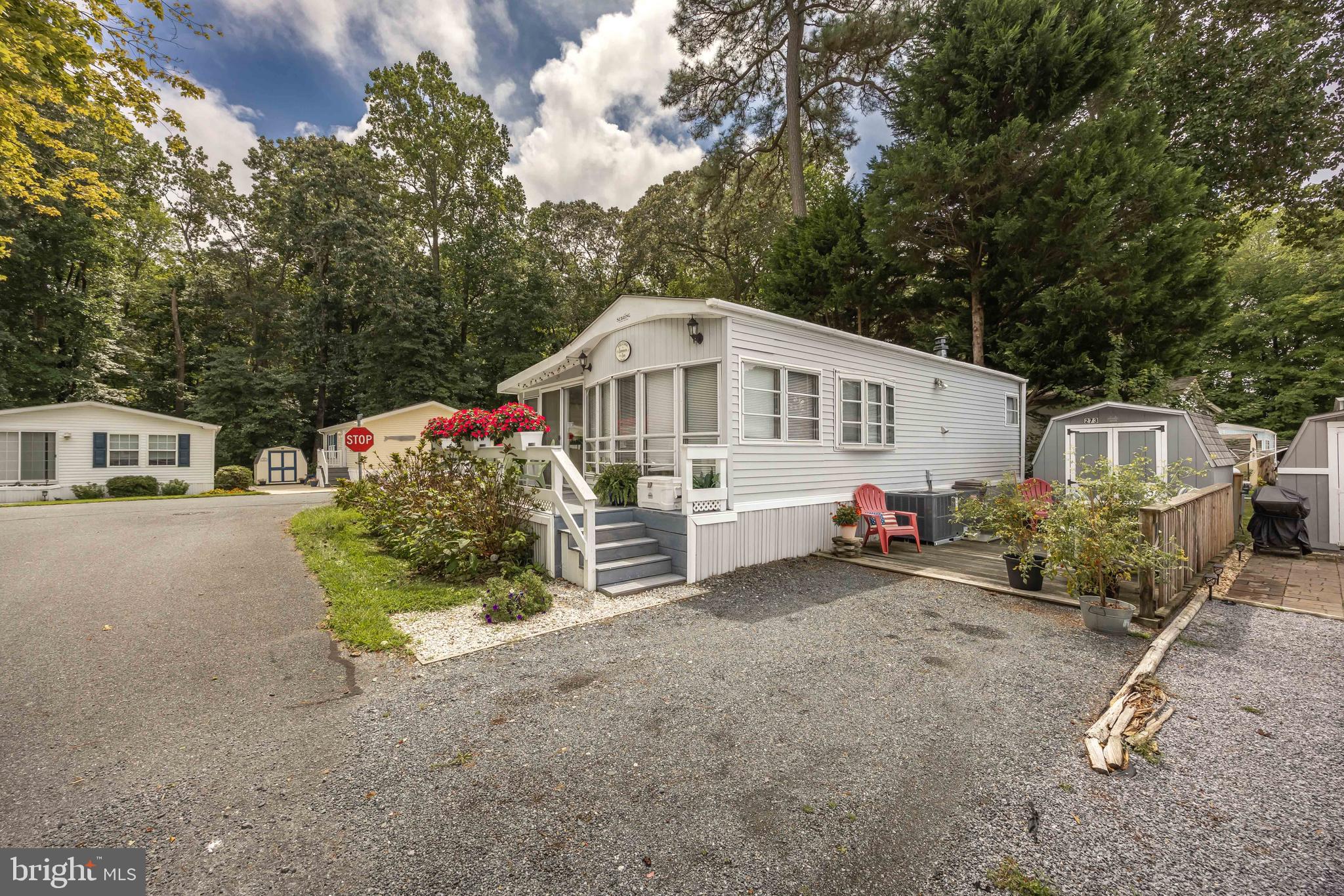 Discover the charm of coastal living in this beautifully maintained 2-bedroom, 1- bath manufactured home with a spacious addition, perfectly situated on a desirable corner lot in the peaceful White Horse Park community of Ocean Pines, Md.
This seasonal retreat offers the ideal escape with serene surroundings and all the comforts of home. Inside, you'll find a bright and generous living area, a well appointed kitchen, and cozy bedrooms. The home comes partially furnished. Recent updates ensure peace of mind. The interior has been renovated within the past 3 years. New flooring throughout, the roof is only 4 years old, brand new HVAC system. White Horse Park offers wonderful amenities, including a community pool, Playground, boat ramp, and clubhouse. Everything you need for recreation and relaxation. Enjoy the best of both worlds: Tranquil park living with easy access to the vibrant beaches and boardwalk of Ocean City Maryland. Don't miss this rare opportunity to own your own slice of paradise in a sought-after seasonal community. Your coastal vacation oasis is waiting!