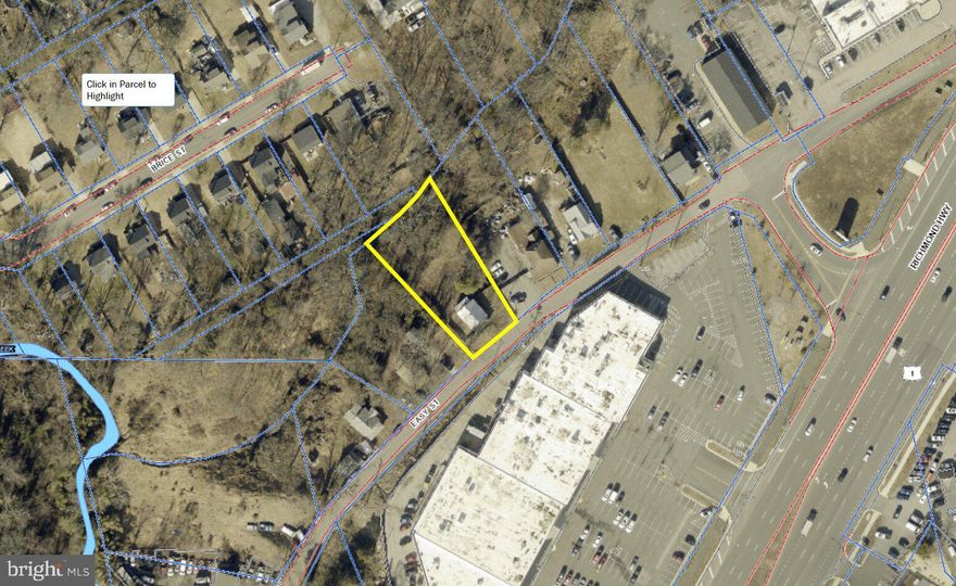 Commercial infill opportunity along one of Northern Virginia's busiest corridors. This ±16,186 SF parcel carries B-1 General Business District zoning in  Prince William County no rezoning required. By-right permitted uses include retail, restaurant, professional and medical office, personal services, financial services, childcare and more. At a 0.40 FAR, the site supports up to approximately 6,474 SF of gross building area. Public water and sewer are available through PWCSA, the site is confirmed FEMA Zone X (out of the flood hazard area), and the parcel is located within a federally designated Qualified Opportunity Zone offering potential tax advantages for buyers with eligible capital gains. The location delivers: over 36,000 vehicles per day at the Easy Street/Route 1 intersection, Woodbridge VRE Station is 0.4 miles away, and the one-mile trade area supports nearly 19,000 residents at a median household income approaching $80,500. A condemned 1935-era residential structure currently occupies the site and will need to be razed prior to or concurrent with development. A new site plan submission to PWC Development Services will be required. Entitled B-1 land at this price point, in this location, does not come available often in Woodbridge.