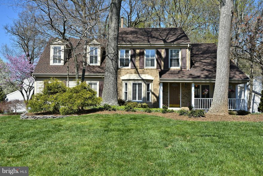 Beautiful one owner front porch home in sought after neighborhood with renovated kitchen and baths; h/w flrs; stunning architectural details; 2 story LR; MBR w/ sit rm and lux bath; teen suite; Fam Rm w/ frplc (wall mount TV & lamps convey); deck/patio; newer windows, doors, roof, siding, HVAC systems, H2O heater, exterior wrap; plantation shutters; rec rm & den/br on LL; lovely landscaping!