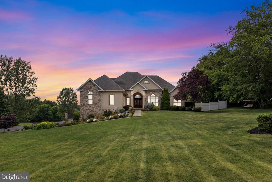 Discover this exceptional 6000 sq. ft.  home set on a picturesque 3-acre lot with stunning landscaping, private driveway,  waterfall and koi pond.  A majestic grand entry with 12' high ceilings sets the tone for this elegant home. Enjoy meals in the spacious dining area or the separate breakfast room, which features a brand-new cooktop island and a double tray ceiling. The recently remodeled kitchen boasts Silestone quartz countertops, recessed lighting, large walk-in pantry and a convenient half bath and modern SS appliances. Perfect for entertaining, the expansive 26 x 25 Great Room/Living Room with 16' vaulted ceiling with skylight, a stone fireplace, exposed beams, wet bar and access to large deck overlooking the heated inground saltwater pool with a waterfall. Primary Bedroom Suite  includes a double tray ceiling, a cozy sitting area with deck access, a large walk-in closet, and a luxurious bathroom with a vaulted ceiling, Jacuzzi tub, and tiled shower. Possible In-Law Suites on the main level, private one bedroom with a full bath and a two-bedroom suite off the kitchen with a full bath.  Lower Level Family Room features barn board accents, a media bonus room with 10' high ceilings, a stone gas fireplace with a mantel, surround sound, a 12 x 7 screen, eight movie theater chairs, and a projector.  Upper level includes one bedroom, full bath, and a versatile bonus room.  Outdoor amenities on the property features a chain-linked fenced and 
wrought iron fencing with pillars and lights around the pool and a pool house, perfect for outdoor entertaining and relaxation. The home is equipped with geothermal heating and air conditioning, backed by an electric heat pump and tankless hot water system. This property combines elegance, functionality, and luxury, providing a perfect sanctuary for comfortable living and entertaining. Don't miss the chance to own this remarkable home, ideal for a large family or accommodating guests