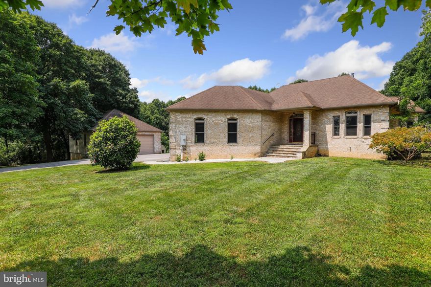 A remarkable home on 1.37 acres peaceful and very private location.  The kitchen has been totally renovated with induction cooktop ,  brilliant Quartz countertops and stylish marble backsplash.   Sub Zero freezer, Monogram refrigerator  , WIFI toaster oven and microwave. Wine fridge.  Omega  cabinets and amazing pendant lighting.  Main floor includes heated floors . A private office with hardwood flooring. The living room upgrades  include a stone fireplace with a Pellet Stove insert.  The master bedroom  with a lighted tray ceiling. Jacuzzi tub. A large maintenance free deck for relaxing  and entertaining.

 Several recent updates include Hot water heater (2022) Well pump (2018) AC Condenser unit (2021) .  One two car attached garage and a second mechanic's  dream, detached garage with its own heating and cooling system and compressor hook ups.  A large maintenance free deck for relaxing  and entertaining.
 Amazing country living close to fun local breweries, wineries, shopping and schools!