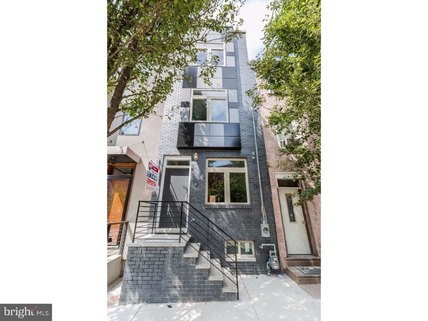 A towering Old Kensington (South Kensington) 3 story new construction with 10 year tax abatement, 3 bedrooms, 3 full baths, private yard, panoramic roof deck, and finished basement. This home has hand carved dark chocolate hard wood floors throughout, custom tile in the basement and in every bath, high end vanities and low flow toilets in all of the baths, recessed lighting and a front load stainless stacked washer and dryer on the 2nd floor level. The exterior front facade is beautiful with black brick and custom made steel hand rails in the front back and interior of the home. Enter in to the straight through open floor plan, filled with natural light. The dining room wall is open and leads to the beautiful finished basement.The kitchen comes with beautiful shaker cabinets, granite counters, glass subway back splash, stainless appliances, and access to the yard. The 2nd floor has 2 spacious bedrooms and a hall bath and laundry room. The 3rd floor is the master suite with walk in closet and there is stairs to the roof deck from the 3rd floor hall. Located in the highly desired neighborhood with only a few blocks from Fishtown and Northern Liberties offering easy access to everything.