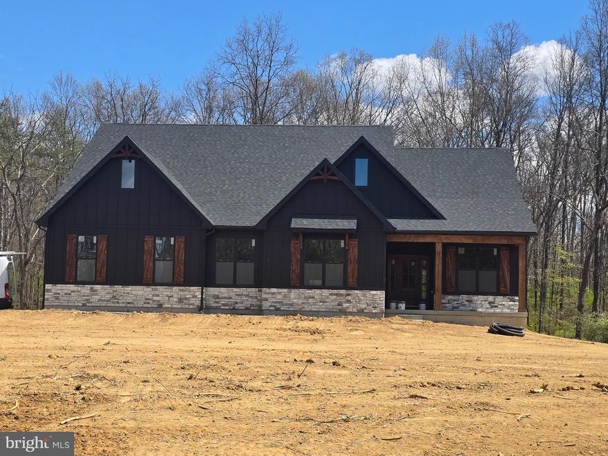 Level 5.17 +/- acre lot with no HOA. Animal friendly in a convenient yet rural setting and an ideal commuter location. Your new quality built home will fit perfectly and will include the following: 4 bedrooms with 3.5 baths ranch farm house style home. Quality construction nicely upgraded with full kitchen appliance package, granite, luxury vinyl plank flooring, carpet, soft close cabinets, vaulted ceilings & more. Full unfinished basement. Close to amenities. Pictures are of similar finishes with various upgrades. May 12th 2025 delivery.