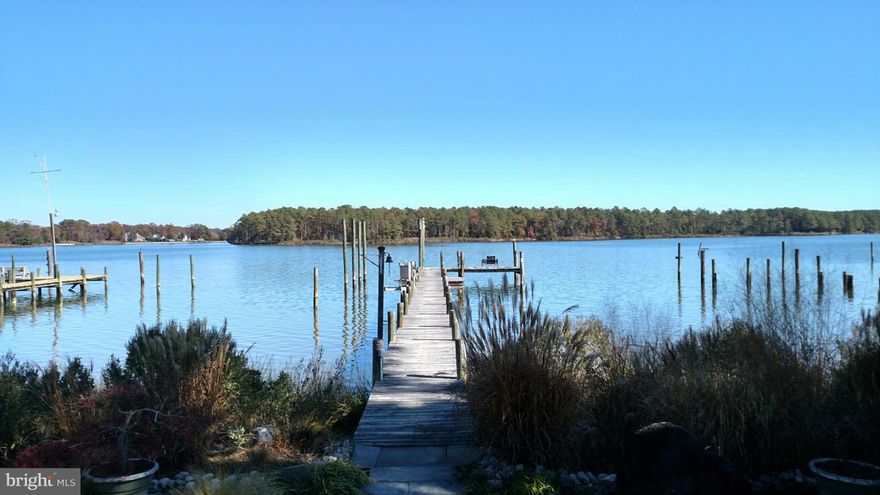 LOVELY WATERFRONT PROPERTY WITH  AMAZING VIEWS & DEEP WATER, PRIVATE 150 FOOT "L" SHAPED PIER HAS WATER/ELECTRIC, 1500LB BOAT LIFT.  OPEN FLOOR PLAN W/ VAULTED CEILINGS IN LIVING ROOM, PELLA WINDOWS, BRAZILIAN CHERRY WOOD FLOORS. ADD'L LOFT SPACE IN LR COULD BE OPENED UP, APPLIANCES.PROFESSIONALLY LANDSCAPED, 10X16 SHED W/ELEC, NEW DECK ACROSS WATER SIDE.