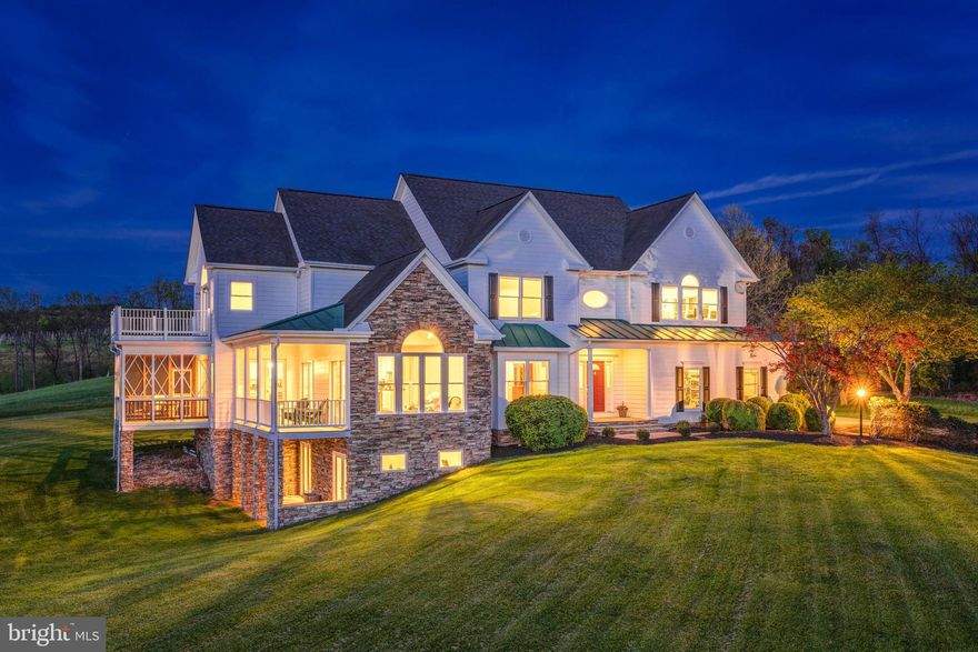 Escape to this serene 10-acre country estate in Paeonian Springs, where breathtaking west-facing sunset views create a backdrop for a truly exceptional lifestyle. This custom designed home available for the first time from its original owners, this lovingly maintained home blends contemporary updates and traditional architecture to create an airy, open layout perfect for modern living. Only 10 minutes from downtown Leesburg, life here feels like a different world, with a slower, more intentional pace of life. Approach through idyllic countryside to a side-load 3-stall garage and large motorcourt driveway welcoming you home. Enter inside to a grand two-story foyer and formal living room filled with natural light, featuring a charming window seat that frames the endless rolling-hill views. The property has been meticulously updated with freshly refinished cherry wood floors and new carpeting in 2025, plus new interior and exterior paint within the last year. The formal dining space showcases elegant moldings and a ceiling medallion, providing versatility for both grand entertaining and intimate gatherings. From here, transition directly outside or through a large mudroom to the expansive backyard. In the kitchen, all-white cabinetry complements multiple dining options, including an eat-in area and generous bar-top seating. Double doors open to the screened porch and open deck, creating seamless indoor-outdoor flow surrounded by pristine country views. Continue into the vaulted family room with cathedral ceilings and a stunning Palladian window that bathes the space in natural sunlight. The main level also features a versatile bedroom suite with a private full bath and two closets, perfect for guests or an in-law suite. Upstairs, the primary suite offers vaulted ceilings above the bedroom and sitting area, a private balcony, and two walk-in closets. The primary bath includes a soaking tub with views, double vanity, and separate shower. This level also hosts two additional bedrooms, a full hall bath with double sinks, a spacious laundry room with ample storage, and a large bonus room used as an artist's studio. The walk-out lower level provides a bright, finished space with a versatile recreation room, an additional bedroom and full bathroom, plus dedicated storage. Enjoy outdoor living on three levels: a deck and screened porch off the main level, a balcony off the upper level, and a shaded patio off the lower level. The 10-acre property includes apple trees and offers endless possibilities with land use tax benefits and no HOA. Located in Loudoun County's wine and horse country, you're just minutes from local vineyards, breweries, schools, parks, and golf courses, with diverse shopping and dining options in nearby historic Leesburg and Purcellville. The charming village of Waterford is just a short drive away. This exceptional property offers the perfect balance of private country living with convenient access to amenities. A rare opportunity to own a piece of Virginia's beautiful countryside with space to truly make it your own.  Property is in land use and Seller not responsible for roll back taxes