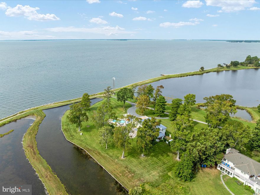 Imagine waking up to breathtaking sunrises over Eastern Bay and the Wye River at 133 Kilby Point Road, a stunning waterfront retreat nestled within the private community of Kilby Point at the tip of Bennett Point. This beautifully renovated 4-bedroom, 2.5-bath residence boasts approximately 3,156 sq. ft. of living space, perfectly blending timeless elegance with modern comforts. Please do not venture down without an appointment - this is a private point - thank you
.
As you step inside, you'll be greeted by the warmth of Provenza engineered hardwood floors, a custom solid wood entry door, and big views that frame the captivating water views steps away. The fully renovated chef's kitchen is a culinary dream, featuring quartz countertops, stainless steel appliances, dual wall ovens, and 6-burner gas range that's sure to delight even the most discerning cooks. Imagine sipping your morning coffee or enjoying a glass of wine while cooking up a storm, with the serene water views as your backdrop.

The main level's open layout seamlessly connects the dining room, living areas, and kitchen, creating an ideal space for entertaining and making memories with family and friends. The intimate porch off the dining room is the perfect spot to enjoy a quiet morning or a sunset cocktail, with the water views providing a serene atmosphere.

Upstairs, the primary suite is a tranquil retreat, complete with a newly built Duradeck balcony (2025) that offers panoramic views of the surrounding waters. The additional three bedrooms, all with water-facing windows, and a renovated hall full bath make this level the perfect haven for family and guests.

The true magic happens outdoors, where the nearly 5-acre property unfolds into a stunning oasis. The heated saltwater pool (2021) is the perfect spot for pool parties and relaxation, surrounded by patios for lounging and landscaped grounds. There are so many more opportunities to add gardens, pergolas, chicken coop and more. As you gaze out across the water in multiple directions, you'll be treated to picturesque views of a lighthouse and a charming old-time windmill, views of the boats sailing to St. Michaels, adding to the property's natural beauty. And, if you're lucky, you might even catch a glimpse of the two resident white swans on the pond and 2 bald eagles perched on the lighthouse that call the property home, or gliding effortlessly across the water. Imagine hosting unforgettable gatherings, with an extra pool enclosure that can be easily converted into a vibrant pool club room or outdoor kitchen. The fireplace is already there. The possibilities are endless, from sunset soirees to family reunions, weddings, and the serene water views provide a breathtaking backdrop for any celebration.

As a resident of Kilby Point, you'll enjoy a 1-mile waterfront walking/golf cart path, and a pier/dock, 1 available boat slip (not deeded, subject to availability). The property's convenient location, to Route50 and the Bay Bridge, makes it easy to explore Annapolis, Washington, D.C., and the charming destinations on Maryland's Eastern Shore, Easton, St Micheals, Oxford and more.
This is a rare opportunity to own such a unique waterfront retreat with extensive upgrades, captivating views, and endless possibilities for entertainment and relaxation. Come make your memories today.