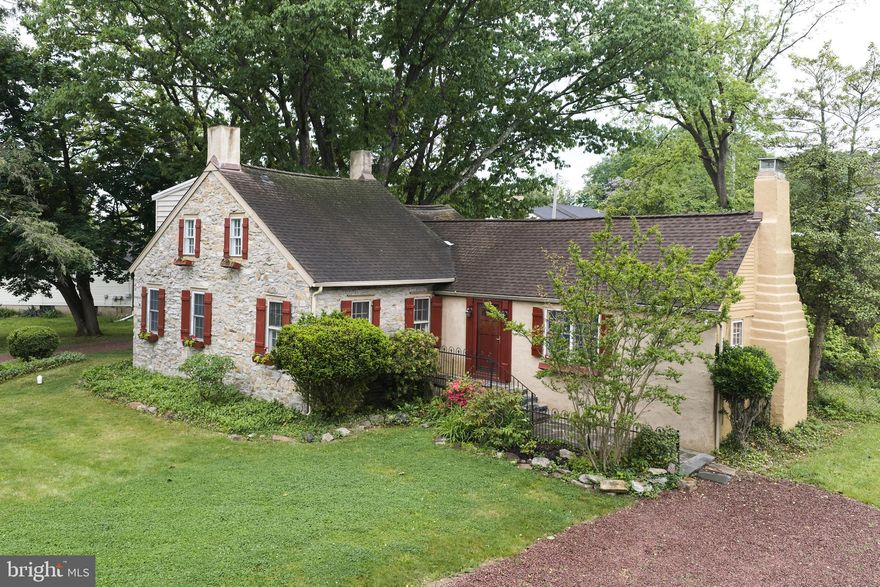 A deed in 1715 is the first evidence of ownership of the lot that would ,in 1752 , would become the  footprint of the original  colonial home.   Multiple later additions would  be added to the home to become the property at 1465 Makefield Road as we know it today.  Purchased in 1965 by the current owners, the home had been expanded in the 1930s to house the current kitchen.  This room features a stone wall that was once part of the exterior wall of the original structure.  Now acting as a backsplash to the stove and adjacent cabinetry,  it tells a tale of time gone by and pays homage to the vibrant history of the original dwelling.  This large room opens to the solarium, an L-shaped room (8' x 22' and 8' x 10') that features a wall of casement windows, 2 skylights, french doors to the rear patio, as well as a breakfast bar.  The formal dining room features hardwood flooring, a stone fireplace with electric insert, deep silled windows and a pair of pendant light fixtures.  A later sunroom addition features a 10' slider, skylight, tile floors, laundry closet, and access to a full bath with stall shower.  The primary suite has been retrofitted for handicap accessibility.  The full bath features a large roll in shower as well  as a newer vanity with granite top and undermount sink.  The primary bedroom features a corner fireplace with electric insert, hardwood flooring, wainscoting, and windows with deep sills.  The living room is reminiscent of a Pocono lodge.  Paneled walls, cathedral ceiling, and large beams create a cozy environment and serve to accent the large stone fireplace that takes center stage in the room.  A bar nestled into a nook opposite the fireplace serves to create an atmosphere of relaxation and fun.  
The second level features a serene bedroom.  The updated en suite bath features a newer vanity with granite counter, and an undermount sink.  Ceramic tile floors, a shower, built-in shelves and a triple window provides plenty of natural light. 
This property has two driveways.  One leads to the attached two car garage, a brick walkway and entry to the solarium, and the other driveway provides access to the front door. A gunite pool with stamped concrete deck  is steps from the sunroom.  A stacked stone knee wall leads to this summer oasis.  There is a patio with plenty of room for outside seating and dining.  
Located in the acclaimed Pennsbury School District, this unique home is centrally located and the perfect commuter location.  Easy access to 95, 295, Route 1, and the Septa train station is close by as well.  Yardley offers great restaurants from casual dining at The Continental Tavern, and Charcoal, to more formal dining at the renowned Yardley Inn.  Starbucks holds court on the corner of  Afton and Main Streets and the Wine and Spirits Store is nearby as well.  Lake Afton- a local gathering spot is the perfect place for winter ice skating and summer relaxing. Professional photos will be uploaded within the next 2weeks once interior work is complete.
