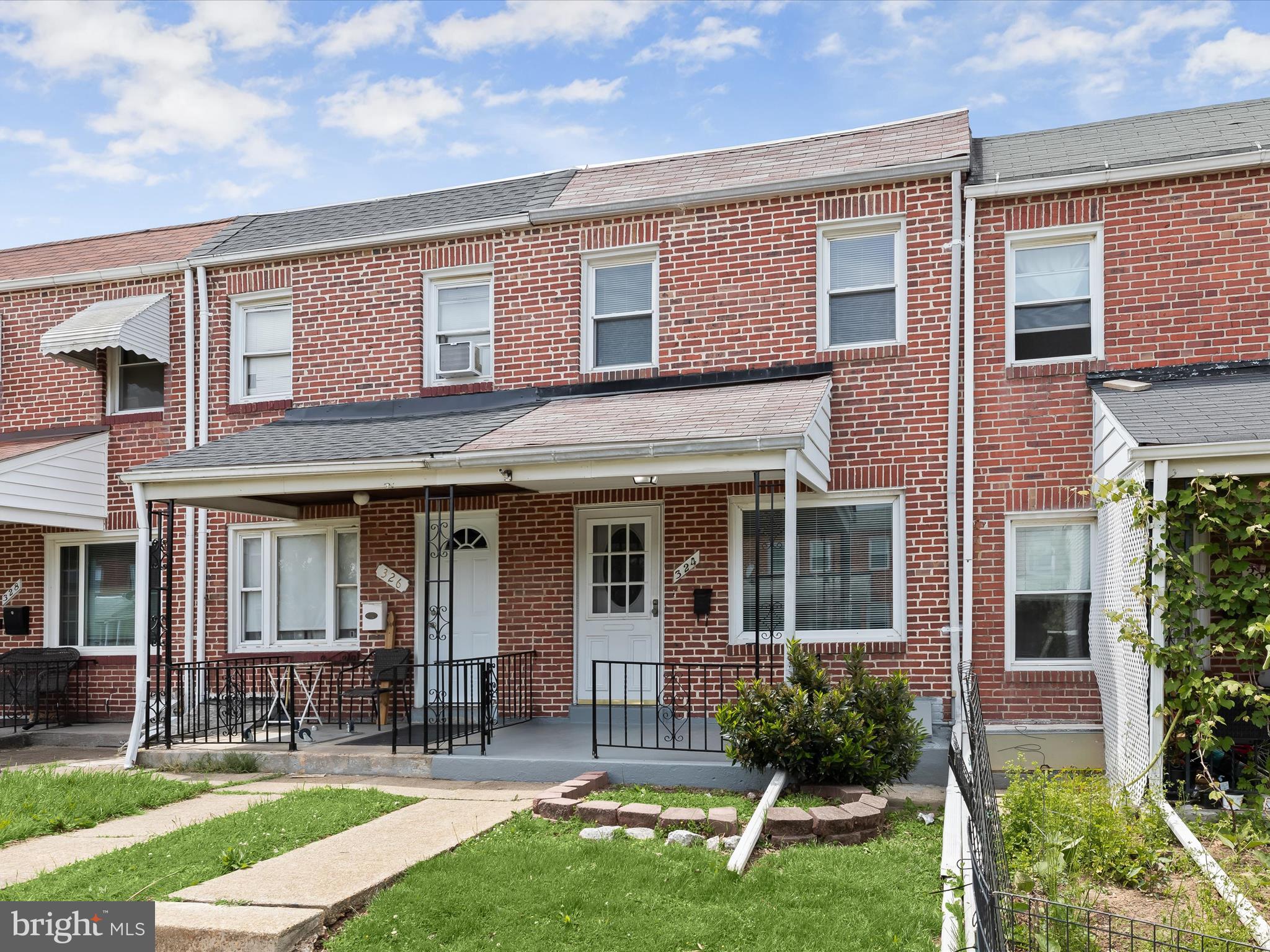 Welcome to this 2-bedroom, 2-bath rowhome in the convenient Bayview neighborhood. Hardwood floors flow through the open living and dining areas, accented by a classic arched entryway. The functional galley kitchen includes coordinating appliances and a tile backsplash. Upstairs, you'll find two bedrooms and an updated hall bath with a skylight for added natural light. The finished walk-out lower level, featuring wood-look laminate flooring, offers extra living space and a full bath. Step outside to the fenced rear patio, perfect for outdoor gatherings. A screened-in porch off the kitchen provides a great spot for fresh air dining. Move-in ready and close to shopping, dining, parks, Johns Hopkins Bayview, and major routes like I-95 and I-895!
Note: Select interior photos have been virtually staged