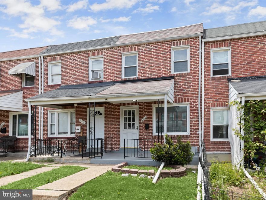 Welcome to this 2-bedroom, 2-bath rowhome in the convenient Bayview neighborhood. Hardwood floors flow through the open living and dining areas, accented by a classic arched entryway. The functional galley kitchen includes coordinating appliances and a tile backsplash. Upstairs, you'll find two bedrooms and an updated hall bath with a skylight for added natural light. The finished walk-out lower level, featuring wood-look laminate flooring, offers extra living space and a full bath. Step outside to the fenced rear patio, perfect for outdoor gatherings. A screened-in porch off the kitchen provides a great spot for fresh air dining. Move-in ready and close to shopping, dining, parks, Johns Hopkins Bayview, and major routes like I-95 and I-895!
Note:  Select interior photos have been virtually staged