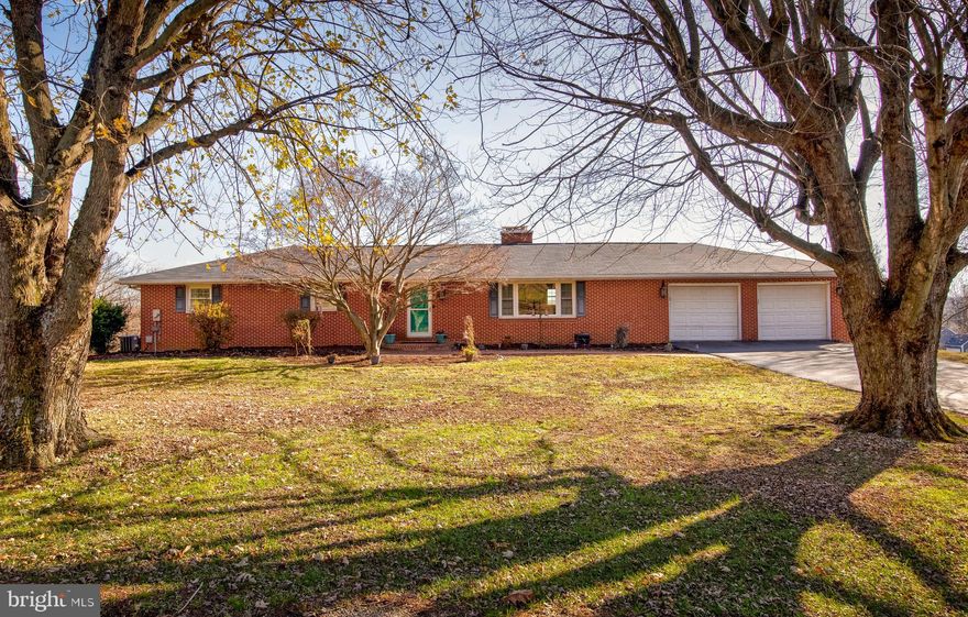 Welcome to 8 Weaver Meadows Road — a 4000 sq ft  all-brick rancher  on 1.48 acres, offering plenty of room to spread out and enjoy. From the moment you arrive, you’ll notice the brick paver sidewalk and brick front porch,  recently repointed, adding timeless curb appeal to this solid home.

Inside, the main level features an expansive living area with hardwood floors that flow through the living room, dining room, and 3 bedrooms. The spacious living room is anchored by a classic brick wood-burning fireplace, perfect for cozy evenings. The kitchen has granite counters, updated appliances  and plenty of room for everyday cooking or entertaining. The primary suite includes an updated bathroom with a walk-in tiled shower.

The lower level offers an  in-law or au pair suite with its own kitchen, living area, den or bedroom, and full updated  bath. A second brick fireplace makes the space warm and inviting. French doors open to a 90 foot covered concrete patio with ceiling fans, creating the perfect spot to relax or host gatherings while enjoying the peaceful surroundings.

This home also includes an attached two-car garage and two driveways, providing convenient access to both the main home and the lower-level suite.

Recent updates include a new roof in 2023, ridge vent in 2025, water heater in 2025, cooktop 2025, flooring in lower level kitchen/laundry 2025, updated primary bath, updated lower level bath, chimney inspection and cleaning with new stainless steel caps and fresh paint downstairs. Boiler and HVAC both  serviced in 2025. The lower level also features two large storage rooms. Oil heat is a great bonus here — it’s an efficient system that delivers a deep, consistent warmth, keeping the house comfortably cozy all winter.

With quality brick construction, generous space, and flexible living options, this home is ideal for multi-generational living or anyone looking for comfort and room to grow—all with no HOA.