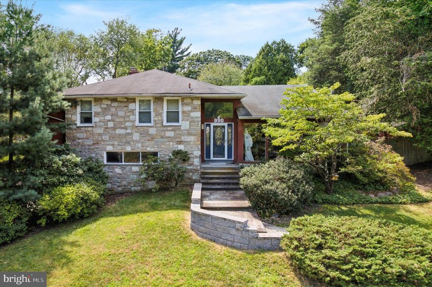 **Abington Township** Welcome to 990 Indian Creek Road, a beautifully maintained stone-front split-level home in Jenkintown Manor offering more than 3,000 square feet of living space with 4 bedrooms and 2.5 baths. The open floor plan is ideal for entertaining, featuring a sun-filled living room with cathedral ceilings and large windows, a spacious kitchen with abundant cabinetry and an oversized island, a formal dining room, and a family room with a stone-front gas fireplace. The primary suite includes a tile bath with walk-in shower and a large walk-in closet with laundry. The finished lower level provides flexible living and storage space. Outdoor amenities include a sparkling saltwater pool, relaxing hot tub, Trex deck, outdoor dining and grilling area, a pool cabana with a convenient half bath and changing room, and a greenhouse. This rare offering in the award-winning Abington School District is just minutes from shops, dining, and major roadways.