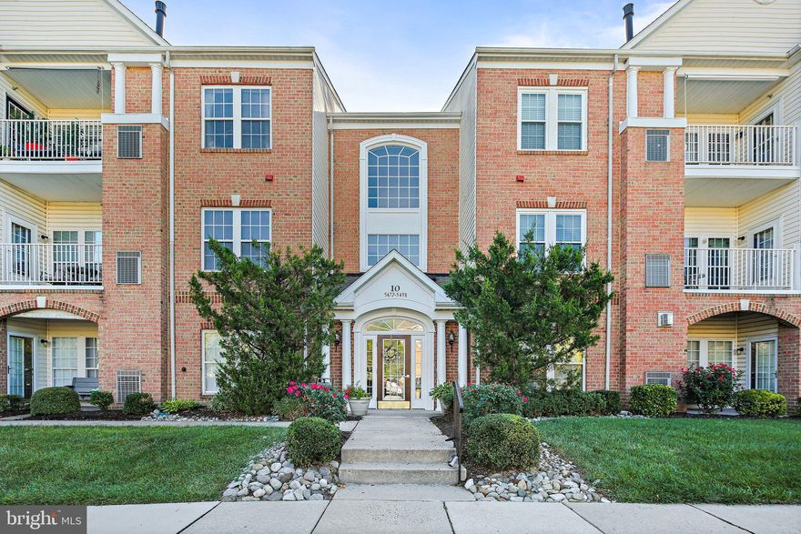 Welcome to 5496 Glenthorne Court, a bright and spacious 2-bedroom, and 2-bath condominium with in-unit laundry in the desirable Devonshire at White Marsh community. With over 1,600 square feet of living space, this home offers an open and inviting layout designed for both everyday comfort and effortless entertaining. The generous living and dining areas flow seamlessly to a private balcony—perfect for morning coffee or evening relaxation. The kitchen features white cabinetry, gas cooking, and plenty of counter space for meal preparation. Retreat to the primary suite with its vaulted ceiling, walk-in closet, and private bath complete with dual vanity and tub/shower. A second bedroom with an en-suite bath provides additional comfort and convenience. A generous sized loft  overlooks the main living area and includes a large storage closet. Ideally located near shopping, dining, and major commuter routes, this home combines style, space, and convenience in a highly sought-after setting. Don't miss!