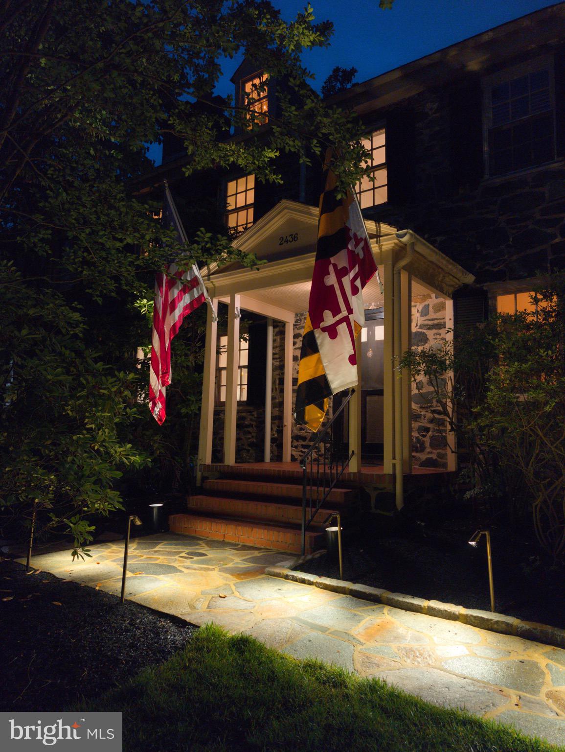 Step into Baltimore history at 2436 Pickwick Road—an exquisite 1840s stone residence nestled in the heart of the nationally recognized Dickeyville Historic District. Thoughtfully restored and masterfully maintained, this exquisite. 5-bedroom home blends timeless craftsmanship and finishes with modern comfort and ample storage throughout. From its original mill village roots, Dickeyville has evolved into one of Baltimore’s most cherished enclaves—tucked alongside the Gwynns Falls, rich in community spirit, and defined by cobblestone paths, gas lamps, and preserved architecture. This residence sits proudly on a private knoll, offering a stately center-hall layout, expansive reception rooms, renovated kitchen plus butler’s kitchen, and five generous bedrooms. Outside, enjoy lush gardens, mature landscaping, and a rare two-car stone garage—all moments from trails, parks, and the Gwynns Falls. Historic character, refined living, and a sense of place that’s truly one of one.