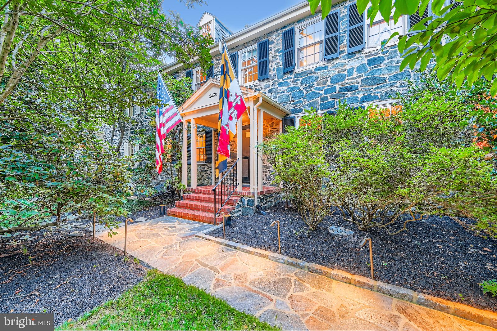 This one is straight out of a magazine! Your Dream Home in Storybook Dickeyville - where cobblestone charm meets modern convenience. Tucked along the Gwynns Falls and bordered by Leakin Park, this village feels like a secret garden just 20 minutes from downtown Baltimore and BWI, and only 10 minutes from Catonsville. Originally a 1750s Mill Town, turned historic district, Dickeyville is a rare pocket of preserved architecture, community spirit, and nature. Think: walkable streets, original stone homes, and quiet corners that feel like a step back in time - without leaving the City. This grand stone beauty, built circa 1840, is one of the largest in the neighborhood and sits proudly on a landscaped rise in the heart of the village. Over 3,300 square feet of fully renovated living space blends original character with the updates you’d expect in a luxury home today. Boasting a stately center-hall layout, large, sun-filled living and dining rooms, a thoughtfully renovated kitchen with marble countertops, high-end appliances, a massive island, and wall-to-wall garden views, a butler's kitchen built to entertain, a cozy den or main-level bedroom, a main-level powder room, dual staircases and more! The upper level of the home unfolds into a light-soaked conservatory with French doors and a private balcony. There’s also a wood-burning fireplace in the oversized family room, a custom-built home office, a high-end marble bath and a laundry room that feels more spa than chore. The primary suite brings the wow factor with more marble finishes, dual closets, and a luxe shower. Two additional bedrooms and attic space await on the third floor - perfect for guests, studios, a hobby room, home gym or anything else life brings your way. Details like Marvin windows throughout, central A/C, a slate roof, and a two-car garage (with an extra deeded lot just across the drive for even more parking), round out the package. Homes like this don’t come up often in Dickeyville - especially not ones this dialed-in. If you’re craving something special that blends soul, space, and story… this is it! DO NOT MISS THIS ONE!