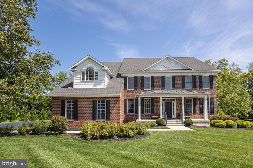 Located on a private cul-de-sac in Upper Makefield Township, this stunning property is move-in ready! The warm and welcoming front porch sets the stage for this beautiful brick and Hardiplank siding colonial. Meticulously maintained with thoughtful improvements throughout, this home exudes both sophistication and comfort. With natural light flooding the space, the Main Level features a lovely open layout with custom crown molding and wainscoting throughout the rooms. Entertain in the formal Dining Room with convenient access to a Butler’s Pantry ideal for serving and prep and easily flows into the Gourmet Kitchen. Highlighting an abundance of cabinetry this space is the centerpiece of the home. An oversized island with seating, a Subzero refrigerator, a Wolf stovetop and oven, display cabinets, granite countertops, Travertine floors, convenient back staircase and breakfast area are just a few of the amenities this chef’s space has to offer. The Gathering Room features an exquisite 2 story Palladian window, and gas fireplace. Working from home is a joy with a separate Study that can be closed off by French doors. Ascend to the upper level showcasing a new wrought iron railing system and new wood floors. The Main Suite offers wonderful space and includes a tray ceiling, sitting area and two spacious walk-in closets. The Main Bath is the perfect relaxation space and includes a dual vanity, shower and a Jacuzzi tub. 3 additional bedrooms, including a Princess Suite with private bath, and an additional Hall Bath can be found on this level. If one is looking for even more living space, the Lower Level is the ultimate in flex space. Currently demonstrating a Gym with large closet, that can easily be outfitted as a Bathroom if one desires, a Home Theater, a built-in Quartz Bar with a beverage refrigerator and recreation area. The backyard offers a spacious composite deck with wooded backdrop. Additional amenities include a 3 car garage, a mudroom with side entrance, a Generac Whole house generator, a garage wired for electric vehicles, a whole house reverse osmosis water treatment system, a full yard invisible fence for pets and a Rainbird lawn sprinkler system. This property’s location also gives access to the HOA’s 40+ acres of natural land that is open for resident’s recreational use including hiking, ATV riding, bow hunting and more. Within minutes to downtown New Hope, Washington Crossing, Newtown, I-295 corridor and walking distance to the Delaware Canal Towpath, this picturesque property is one you don’t want to miss and within the highly desired Council Rock school district.