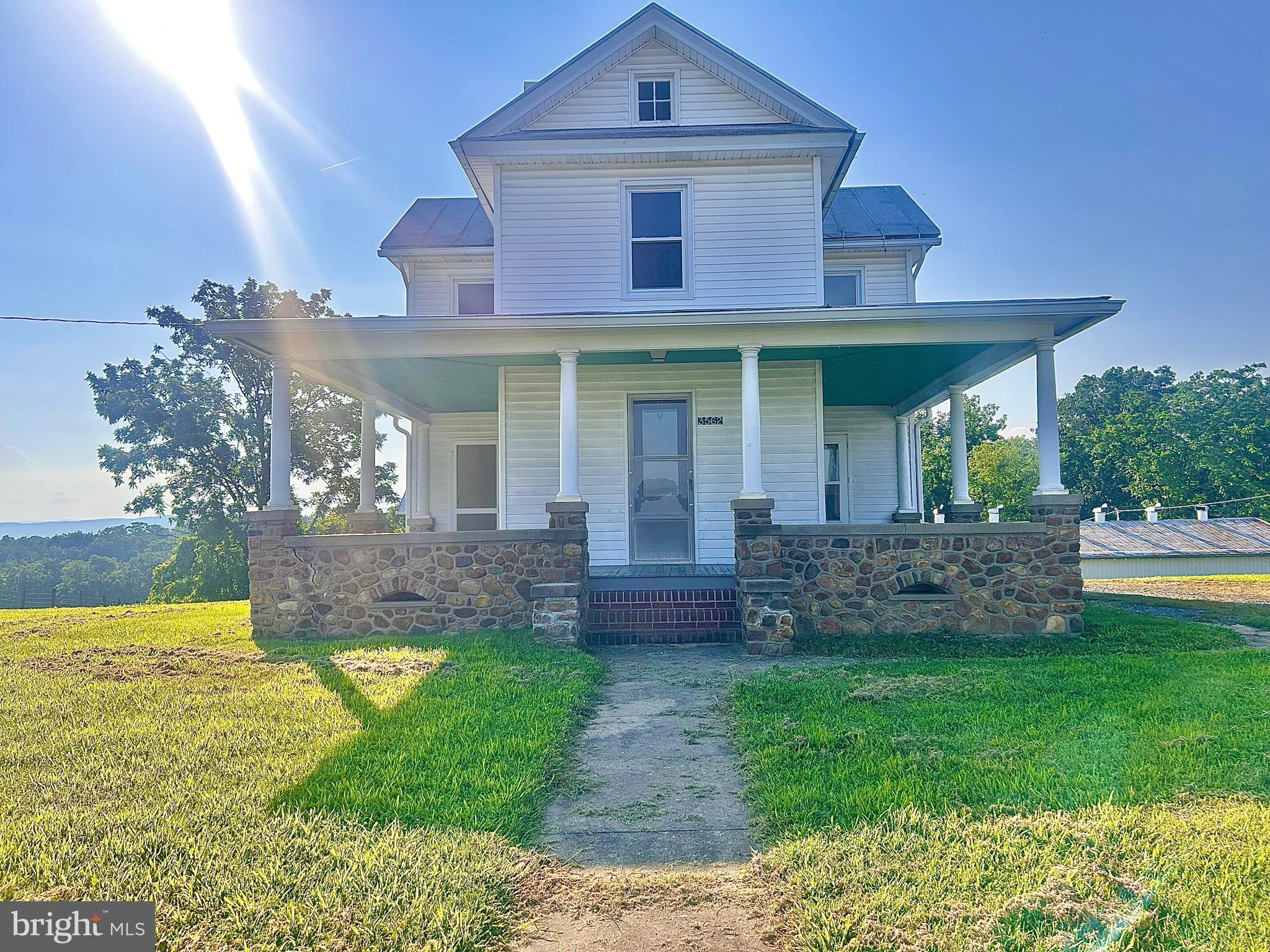 Charming 3-Bedroom Farmhouse with Wraparound Porch – $1,400/Month
Now available for rent! This 3-bedroom, 1-bath well maintained farmhouse offers vintage charm and room to spread out, just outside of town limits. Inside, you’ll find a spacious layout, original woodwork, and a bright kitchen with solid wood cabinetry and a propane gas stove for cooking.
Step outside to enjoy beautiful views from the wraparound porch! Enjoy use of the large yard and two sheds/workshops.
Pets on case by case basis.