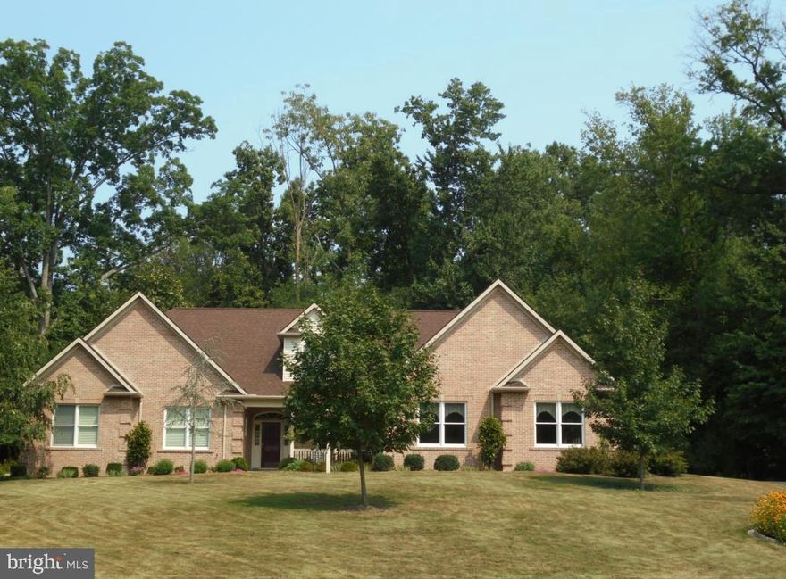 First Floor Living At It's Best! This custom Cape Cod, built by Fred Metzler, is situated on a professionally landscaped 1.19 acre lot with wooded backdrop. Features of the home include: 9' ceilings on first floor; Great room w/gas fireplace; library w/built-ins; stunning eat-in kitchen w/tons of cabinets, Corian counters, walk-in pantry, 2 ovens & Fisher Paykel 2-drawer dishwasher;