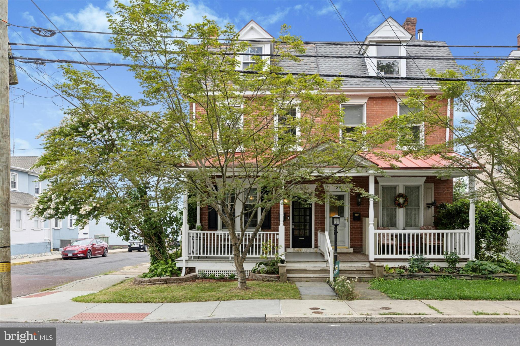 Welcome to 138 W Walnut Street, North Wales, PA – a beautifully preserved 3-story historic home nestled in the heart of Historic North Wales Borough. Located in the charming downtown district, you’ll love being just steps away from quaint shops, local dining, and the train station for an easy commute. This timeless property still showcases its original hardwood floors throughout, adding warmth and character to every room. This home is filled with old-home charm, historic windows, large sills, and beautiful bay windows that flood the space with natural light The spacious kitchen features butcher block countertops and flows into a versatile area off the back of the home — perfect for a mudroom — conveniently located near the half bath and the backyard entrance. Step outside to your fenced-in backyard shaded by mature trees for privacy, leading to your detached one-car garage with extra storage space. From the backyard, you’ll also find one of two entrances to the basement — an ideal space for storage, utilities, and hobbies, complete with a workbench. Upstairs, the second floor offers three generously sized bedrooms and a full bath. On the third floor, you’ll find two additional spacious rooms. If you’ve been dreaming of historic character, walkability, and a true sense of community, 138 W Walnut Street is ready to welcome you home.