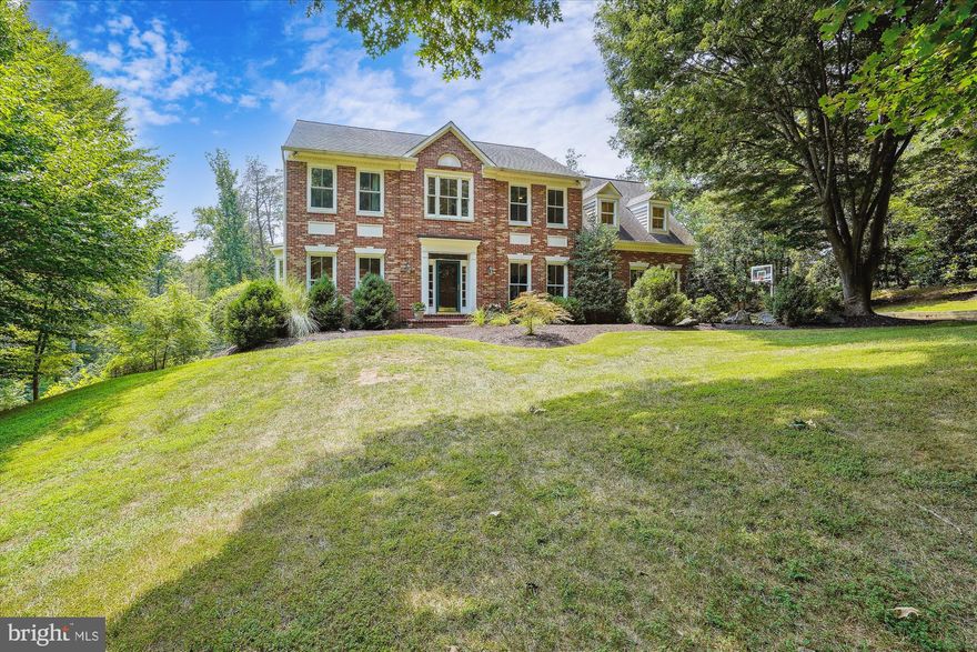 Welcome Home! This stunning custom Colonial, nestled on a sprawling 6-acre wooded lot in the prestigious Wolf Run Estates of Clifton, Virginia, is waiting for you to move in and start entertaining. Imagine hosting gatherings in this magnificent home, especially with the pool ready for enjoyment!

This one-of-a-kind residence offers over 4,500 square feet of impeccably designed living space, featuring soaring ceilings and expansive rooms across three finished levels, including a walkout basement. With 5 generous bedrooms and 3.5 luxurious baths, this home ensures ample space for family and guests alike.

Step inside to discover a warm and inviting family room, complete with a charming wood-burning fireplace that seamlessly flows into a screened-in porch. This tranquil space is perfect for enjoying a morning coffee or evening drink while taking in the breathtaking southwest views. From here, step outside to the fantastic outdoor living area—a newer custom deck and Sundek patio surround an inviting inground swimming pool, perfect for those hot summer days. The property also boasts a soccer/lacrosse field and a spacious front yard, providing endless opportunities for recreation and relaxation.

The home has been lovingly maintained and upgraded, with over $30,000 in improvements completed just four years ago, ensuring a fresh and modern feel throughout. The 2-car side-load garage is ready to welcome your vehicles and hobbies, meeting the needs of even the most discerning buyer.

Located off the scenic Henderson Road, this property backs directly to Fountainhead Regional Park, offering direct access to 20 miles of hiking trails, a serene creek, and the peace and quiet you crave after a long day's work. Despite its private, rural ambiance, the home is conveniently close to the bustling communities of Burke, Centreville, and Manassas, offering a plethora of shopping, dining, and entertainment options, including the charming historic town of Clifton.

With top-rated schools and major commuter routes like Fairfax County Parkway, Route 123/Ox Road, Prince William Parkway, I-66, and the VRE Train & DC Metro nearby, this location offers both seclusion and convenience. Experience the best of suburban living with modern amenities, abundant green spaces, and the quiet, welcoming atmosphere of Clifton, Virginia. This extraordinary home is more than just a place to live—it's a lifestyle. Don't miss your chance to make it your home!