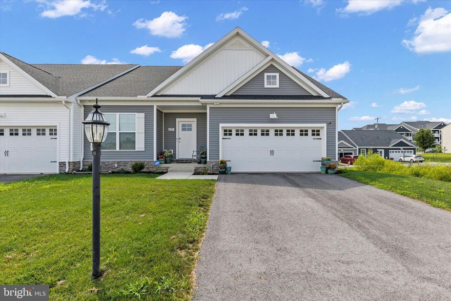 Updated pricing on this Hanover villa! This Belmont Ridge villa combines the ease of one-floor living with a professionally finished walkout lower level, giving you the benefits of new construction without the wait. The recently finished lower level creates a complete additional living area with a fourth bedroom, full bath with heated tile floors, kitchenette, dining space, and a large living room, plus plenty of unfinished storage. Perfect for multi-generational living, long-term guests, or a private retreat. On the main level, you’ll find a light-filled open layout with 9-foot ceilings, a crisp white kitchen with granite counters and stainless appliances, and a spacious living and dining area designed for entertaining. The vaulted ceiling in the primary bedroom adds openness, complemented by a walk-in closet and private bath. Two additional bedrooms, another full bath, and laundry are also on the main floor, making true single-level living possible. Step outside to your back deck for grilling, relaxing, or catching sunsets. Belmont Ridge is a low-maintenance community where lawn care and snow removal are covered, so you can spend more time enjoying nearby Codorus State Park, shopping, dining, and all that Hanover has to offer. Whether you’re downsizing, right-sizing, or just ready for less maintenance, this home checks every box. Schedule your showing today!