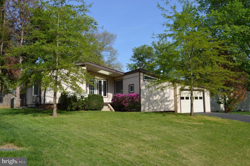 Welcome to 11801 Cherry Grove Drive a convenient North Potomac/Gaithersburg  Location,  Over 2300 Sq Ft above grade!!!
A Rare Blend of Comfort, Space & Versatility (Square foot above grade is 2316 according to MC public record)
Tucked away at the end of a no-thru street in a quiet, low-traffic neighborhood, this contemporary gem sits on a beautifully flat and private .27-acre lot. With a one-car garage, additional carport, and an extended 60-foot driveway perfect for extra parking, a boat, or even an RV, this property offers both convenience and flexibility rarely found in the area.
Step outside to enjoy a spacious 16x21 wood deck equipped with a gas line for grilling (grill conveys!), 95% fenced backyard, and a powered workshop/shed with loft storage—ideal for hobbies or extra space. A backup Honeywell generator and a 40-gallon compressor with hose reel in the garage convey as added bonuses, along with white garage storage cabinets and a utility sink. Recent updates include a new garage door (2022), roof (2011-12), and HVAC system (2019).
Inside, discover over 2,300 square feet across two finished levels with three bedrooms and three full baths, plus a flexible lower-level den. The highlight is a stunning 675 sq. ft. family room addition with vaulted ceilings, skylights, gleaming hardwood floors, and a cozy gas fireplace—ideal for gathering or entertaining around the custom built-in bar. A unique step-up access leads directly to the primary suite, which features double closets, a refreshed vanity, and room to personalize the bath space further. The kitchen boasts a new stainless steel dishwasher, oven, microwave (2025), with a side-by-side refrigerator that includes a water line and ice maker. The kitchen has motion censored lighting and flows effortlessly into the dining area and down into the expansive family room. The lower level offers exciting possibilities, with a walk-up entrance to the side yard, a kitchenette, full bath, and additional appliances—all conveying as-is. Whether for guests, in-laws, or potential rental use (inquire with agent), this space offers flexibility to suit your lifestyle.
Other thoughtful details include fresh carpet throughout (except the primary bedroom), lower-level laundry (W/D convey as-is), and multiple storage areas including a patio shed for outdoor essentials.
Low HOA fees of just $50 per year cover common area landscaping and a neighborhood newsletter and the community is overseen by an Architectural Review Committee for peace of mind.
Don't miss your chance to own this one-of-a-kind home that blends indoor and outdoor living with function, comfort, and flexibility—all in a fantastic, tucked-away setting.  OPEN HOUSE dates:  
SUNDAY   5/18/2025.   1-4PM