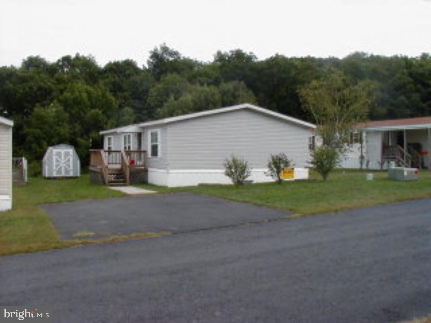 Home on leased lot, cost $299mo. includes land rent, water, sewer, and garbage. $25per person application fee for park approval. Color: gray Amp: 100