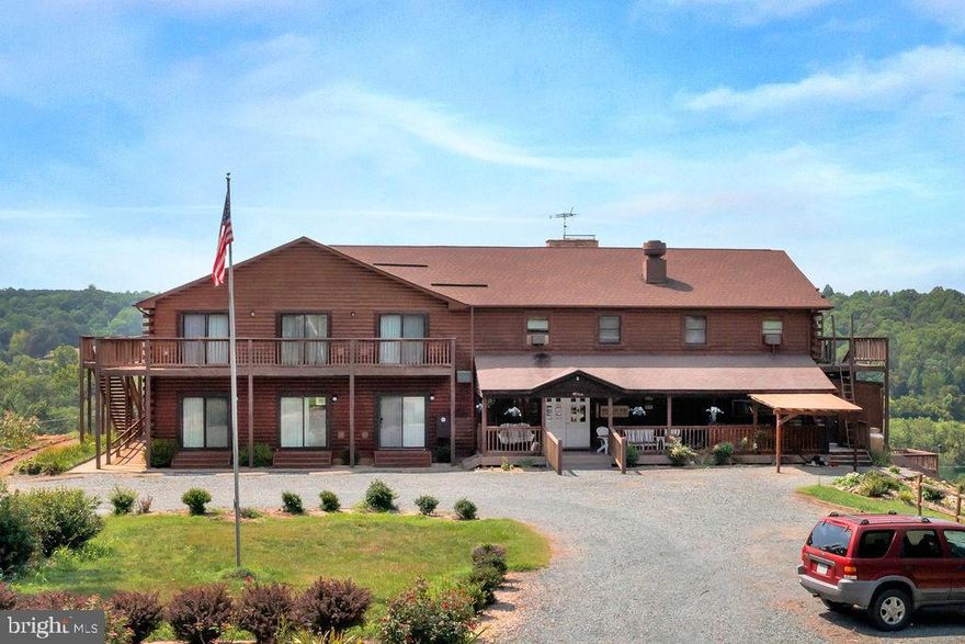 Beautiful WATERFRONT property on the James River!!! Step back from ordinary life and getaway or bring your team on a corporate retreat, enjoying trails throughout the wooded 90 acres. Located on the James River with breathtaking views of the river, farmland, and Blue Ridge Mountains, this property can host large and small groups. After enjoying the lodging and views, wander down to the spacious outdoor deck to enjoy your morning coffee or gathering together inside the Florida room. This property can sleep up to 25 people and has an industrial sized kitchen for amazing home cooked meals. There are award winning restaurants just minutes away in downtown Scottsville and only 25 minutes away from Charlottesville and UVA. This is an excellent opportunity to own this income-producing property as an investment or call it home!