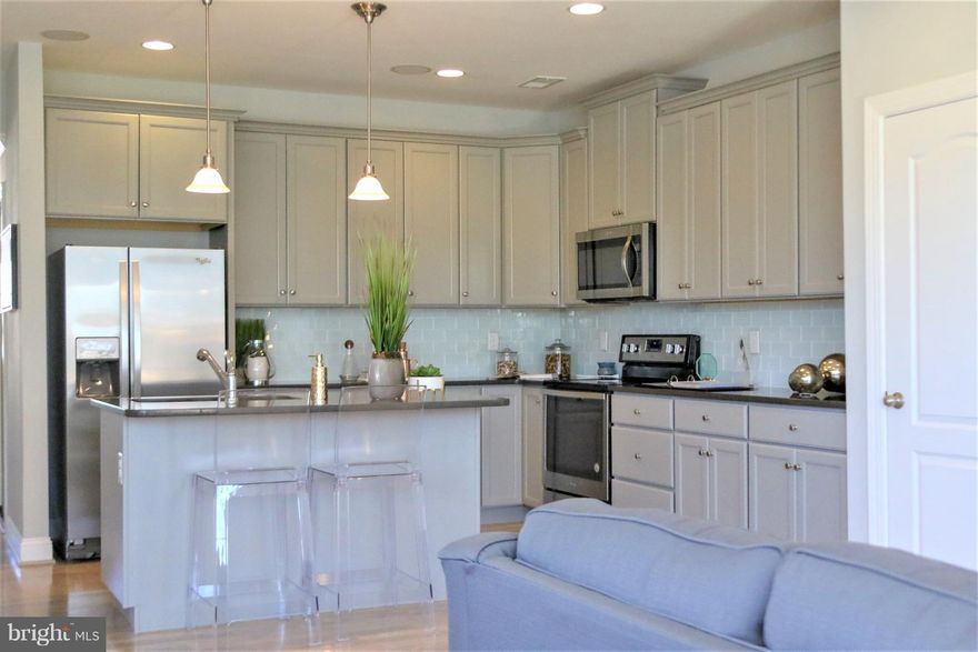 Dan Ryan Builders now offers new stylish townhome plan, the Litchfield, at McCauley Crossing in South Berkeley County. Part stone front, island kitchen with granite tops, maple cabinets & stainless appliances, big bedrooms, upstairs laundry, patio for outdoor living, storage shed. Everyone needs a garage! Lots of energy saving features. Country atmosphere & great for your commute to Virginia