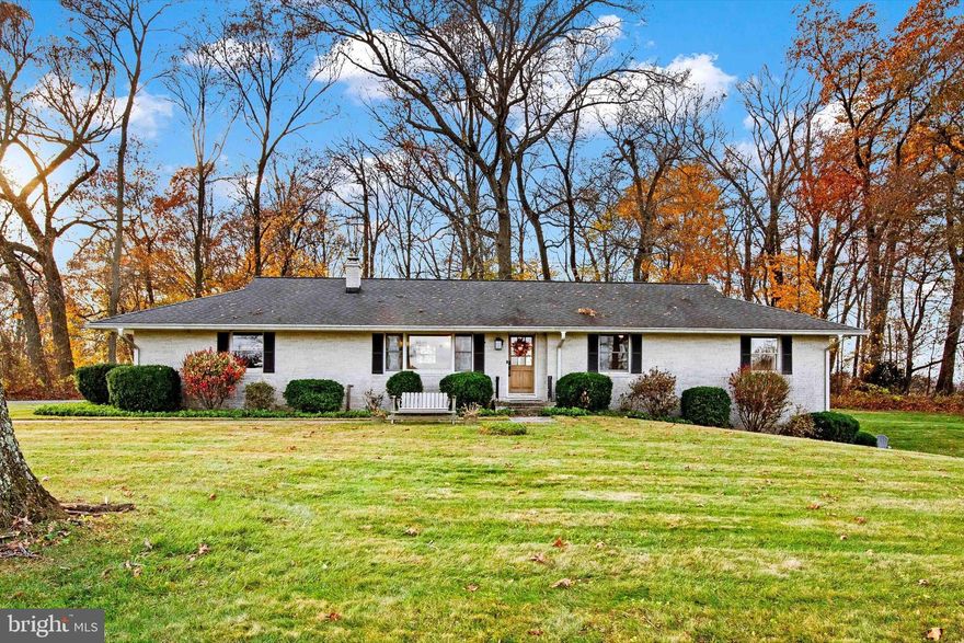 Charming, convenient and completely renovated stone rancher set on a highly sought-after partially wooded and level 2-acre lot surrounded by farmland with stunning sunset views in the heart of idyllic Jarrettsville. Follow the winding driveway to the rear garage and notice plenty of space for parking and playing, mature trees and trails to explore and panoramic views of the surrounding farms. Bright, spacious and open, the main living area lined with lovely laminate flooring is perfect for entertaining, watching the horses across the street through the large picture window or cozying up by the wood stove. The stunning Kitchen includes a huge 9-foot island, brand new quartz countertops, and stainless steel appliances. Enjoy the best sunset views after dinner in the Dining Room which boasts a custom built-in coffee bar and a double pantry to add plenty of storage as well as counter space for parties. You can also enjoy the sunset from the spacious Master Bedroom that fits a king size bed with custom barn doors that double as a window covering and headboard. Two more spacious Bedrooms complete the sleeping areas on the main level. The large hall Bathroom is complete with a custom farmhouse double vanity, attractively-tiled bath, and custom built-in storage. Downstairs, the bright, open, and cozy walkout lower level with private entrance includes another wood stove, an adorable and functional kitchenette with pantry, a full bathroom with soaking tub as well as access to the main level and garage for convenience. Continue using the lower level as the most popular Airbnb in Jarrettsville with hundreds of stays and returning guests to significantly supplement your mortgage, invite your in-laws to live with you in your gorgeous modern-farmhouse-style retreat, or enjoy all of the space for a playroom or even a separate Master Suite. There is an additional room in the lower level which works well as an exercise room or guest room. A spacious laundry room with additional storage space, a workbench and access to the garage completes the lower level. The large custom-built two-level Barn (22x14) with concrete floor and electric is currently a glamping “she-shed” ready for all your ideas or can be used for tons of additional storage space or a workshop. Updates include brand new (2024) Quartz countertops, Stovetop, Dishwasher, and Hot Water Heater. Other updates include plumbing and electric (2014), Trane HVAC Heat Pump (2014), Timberline GAF Architectural Roof (2005), Well Pump (2017), and Barn Siding (2010). They don’t build homes like this anymore! BGE and Verizon Fios are utility providers. Get ready to start 2025 in your new home and enjoy everything the beloved farm town of Jarrettsville has to offer!