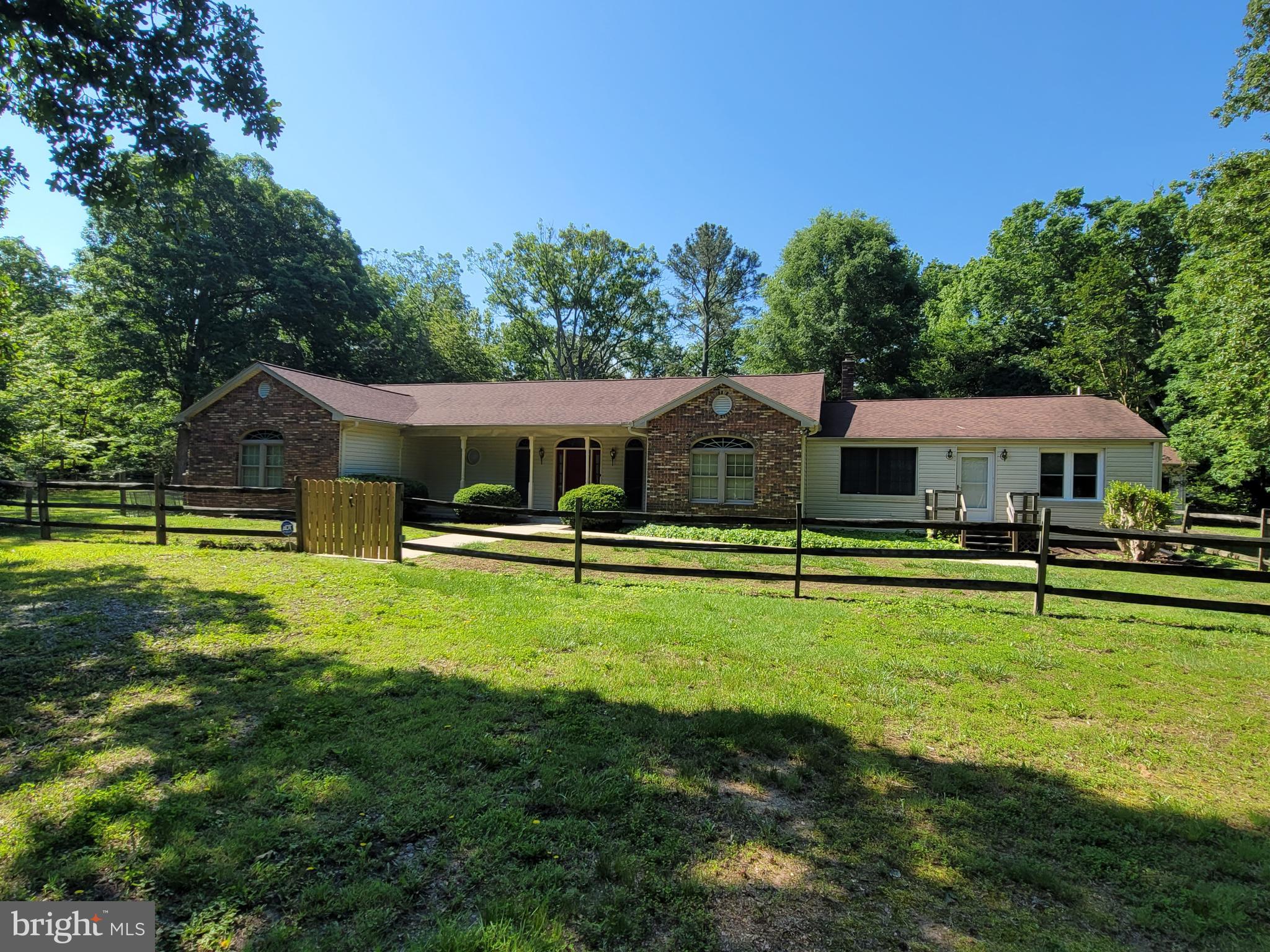 No HOA. Large rambler on a 2.25 acre level lot with 2 driveways. 3 car detached garage. 2 spacious family rooms. Large galley kitchen with a new skylight. Hardwood floors. 4 bedrooms with a den that could be a 5th bedroom. 3 full bathrooms and a half bathroom off of the kitchen. Pantry in kitchen. Wet bar in dining room. Mudroom off of back door. Large laundry room. Large master bedroom has 2 walk in closets and separate shower and bathtub. 2 sinks with vanities. Guest bedroom with ensuite bathroom and large walk in closet. Optional second entrance for in-law suite. With 2 bedrooms, full bathroom and family room. 2 Large walk in closets. Huge finished basement with family room and lots of storage and a separate entrance. Large level backyard with a huge new patio and lots of privacy. Large shed/shop for tractor and garden tools. All conveniently located near, schools, shopping, recreation, and entertainment. Lots of recent upgrades. Move in ready!