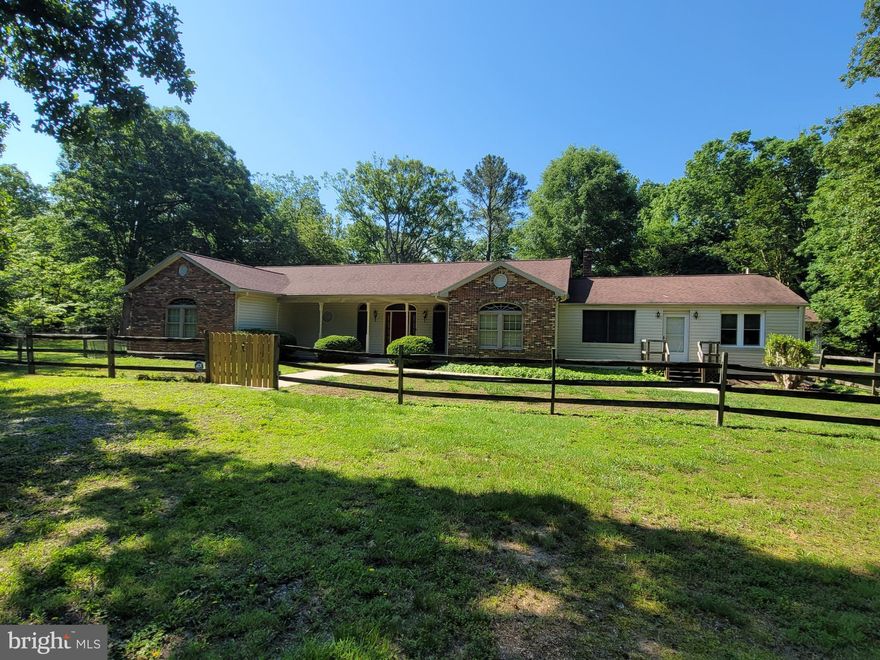 No HOA.  Large rambler on a 2.25 acre level lot with 2 driveways. 3 car detached garage.  2 spacious family rooms. Large galley kitchen with a new skylight. Hardwood floors. 4 bedrooms with a den that could be a 5th bedroom.  3 full bathrooms and a half bathroom off of the kitchen. Pantry in kitchen.  Wet bar in dining room.  Mudroom off of back door.  Large laundry room.  Large master bedroom has 2 walk in closets and separate shower and bathtub. 2 sinks with vanities. Guest bedroom with ensuite bathroom and large walk in closet. Optional second entrance for in-law suite. With 2 bedrooms, full bathroom and family room. 2 Large walk in closets.  Huge finished basement with family room and lots of storage and a separate entrance. Large level backyard with a huge new patio and lots of privacy.  Large shed/shop for tractor and garden tools.  All conveniently located near, schools,  shopping,  recreation,  and entertainment.  Lots of recent upgrades. Move in ready!