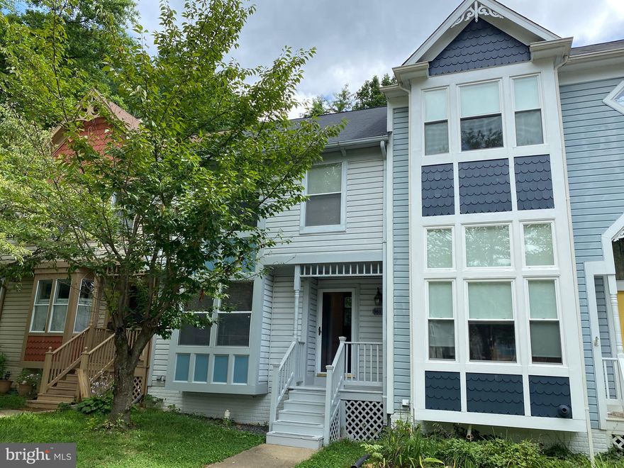 Welcome to a beautiful townhome with a pleasant, airy split-level layout. Enjoy hardwood floors, stainless steel appliances, and stone counter tops. The basement has a walkout to a lovely fenced patio area with wood decking. There is plenty of storage space in this house with a handy utility room and ample closets. Walk to Lake Royal with a nice neighborhood park, hiking trails. Popular schools close by, also near George Mason U. Accessible to VRE train stations, close to "secret garden" Target, restaurants, shopping nearby with local bakery and coffee. 2 reserved parking spaces plus extra spaces with visitor tag. The owner pays the HOA fee.