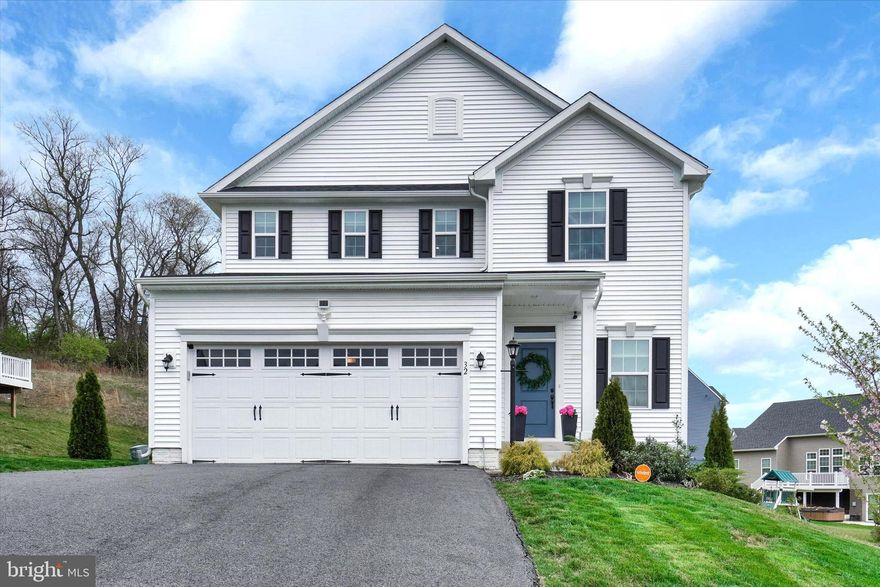 Beautiful Reynolds Overlook, located just off of exit 10 on Rt 83, is a sought after community for the MD commuter!  Easy access to York for shopping, dining and recreation, this lovingly cared for, 4 BR, 2.5 BA, 2 car garage single family home was constructed in 2020 and is in excellent condition!  Shows like a dream!  Features include a rear wooden 12 x 20 deck with stairs and vinyl rails, kitchen with white 42" cabinets that also have crown molding, 9' ceilings, granite counter tops, center island with integrated sink, stainless steel appliances, laminate plank flooring, gas cooking, large dining area, recessed lighting and did we mention it is open to the family room?  The entire main level has laminate plank flooring, bedrooms have carpeting and the full baths have ceramic.  There is a separate laundry room also with ceramic tile flooring on the bedroom level.  This home also features a tankless natural gas water heater, central air conditioning, a Nest programmable thermostat, 3 piece bath rough in plumbing, egress window in the basement, sump pump and passive radon system.  There is also a Vivant Security System already installed.
