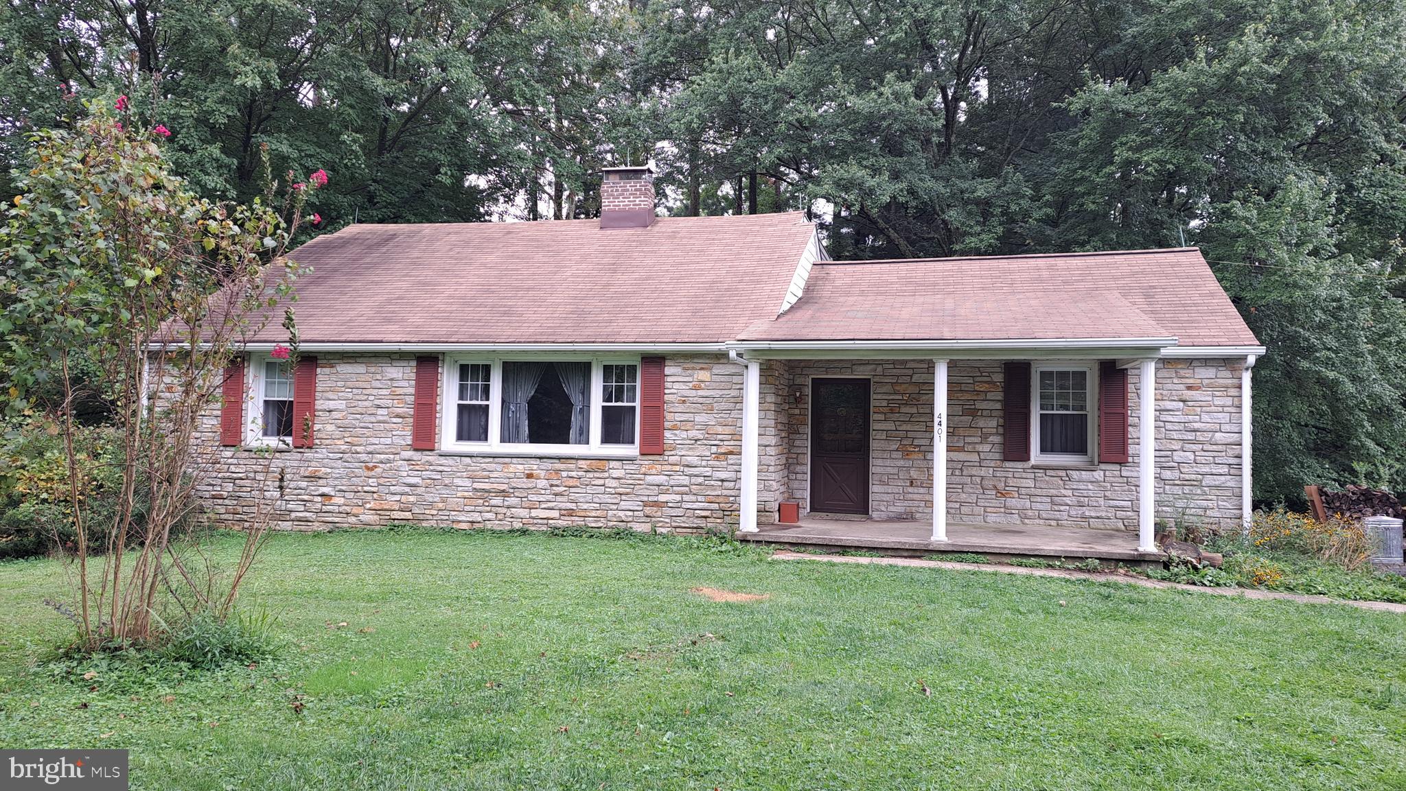 Rare find - 1.6 acres in Perry Hall. 3 bed/2 bath stone front rancher sits on 1 acre + commercial building sits on the remaining .6 acre. Solidly built home with plaster walls and iron enforced block walls. Has wood burning fireplace in living room, state foyer & original hardwood floors throughout main level. Being sold AS IS. Seller will not make any repairs. Update/remodel to suit your personal taste to create the home of your dreams. City water and septic. No HOA.