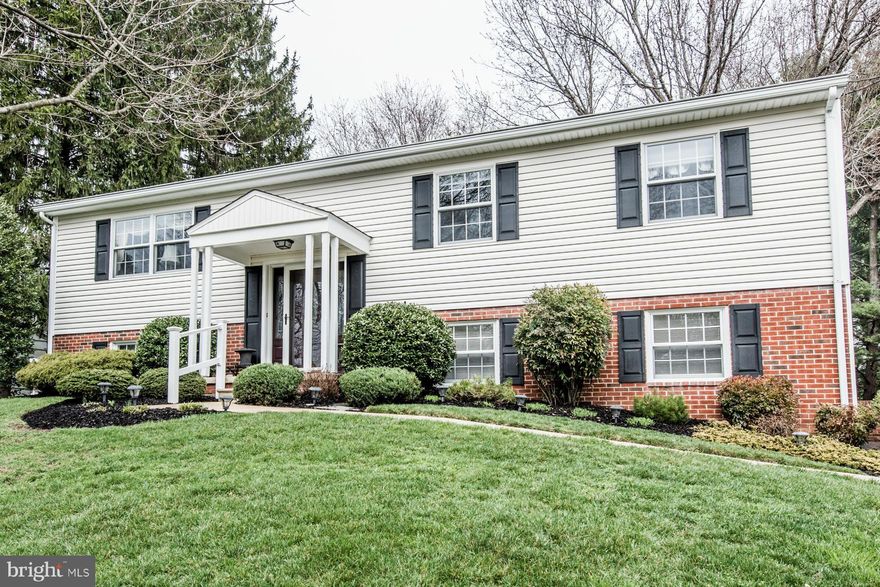 Perched on an elevated lot w/idyllic curb appeal, this home invites you to find an updated kitchen w/granite & custom 42" cabs w/soft close, pull-outs & more! Family room boasts built-in bench seating & flanking bookcases, leading to 3 season room w/vaulted ceiling & skylights, overlooking park-like views. Low maintenance TREX deck. Complete w/FIN LL w/bedroom & half bath, perfect for guests!