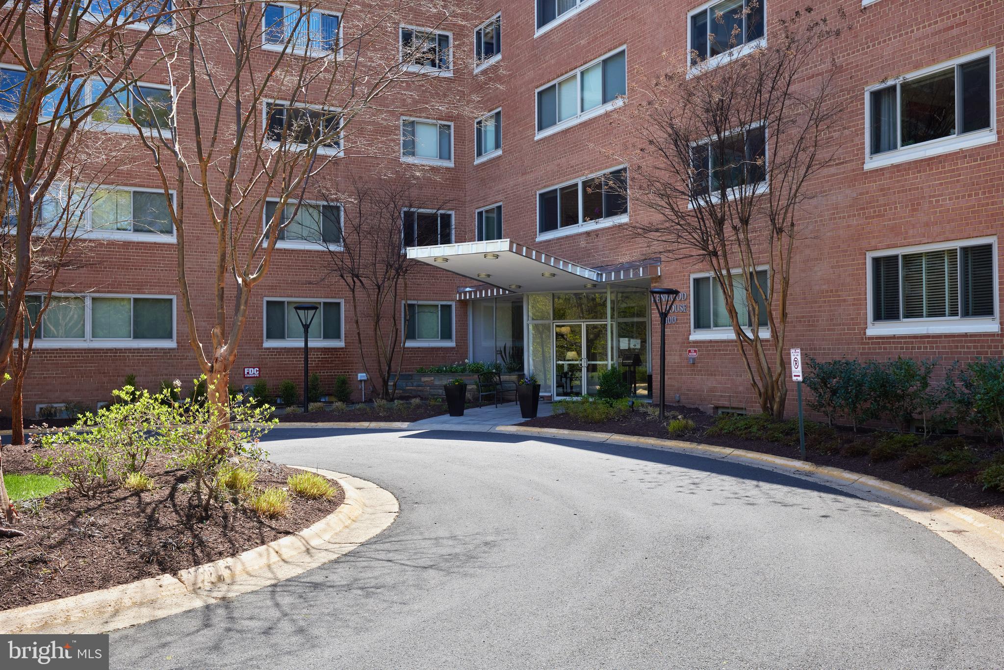 Unbelievable price in The Kenwood House - simply the best value in Bethesda Chevy Chase! Nestled among multi-million-dollar homes, is an unpretentious c.1960 mid-century low-rise structure consisting of 70 residences, literally sitting on the Crescent Trail. Apartment #112 at 840sf is comfortably proportioned and bathed in sunlight, offering a spacious living dining ‘L’ and a generous bedroom with an exceptionally large walk-in closet. Other storage includes a walk-in entry closet, an extra deep linen closet and a useful storage cage in the building’s lower level. Original 60s flat-front kitchen cabinets, original pink tiles in the bathroom with matching soap dished - mad men chic? Enhance or tear it out - at his price you decide! Conveniently located on the lobby level but the sloping topography of the grounds puts the home one level above ground – nice. The modest coop fee of $1065.69 includes includes 1 Covered Parking Space, Water, Electric, Gas, Trash, Recycling, Common Area Building, Grounds Maintenance, AND TAXES. ***Did you miss the infamous Kenwood cherry blossoms this year? Never again!