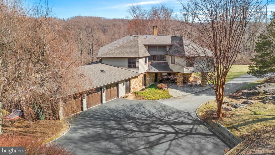 Tax Parcel 07-013.00-038:   Included in the price are the two adjacent tax parcel numbers 07-013.00-069 and 07-013.00-044 the total property consists of three residences, a studio and a barn on a total of 36.8 acres for a total price of $10,000,000. High on top of a hill with total privacy on 24 acres, bordered by lands of Granogue, the Brandywine River and Brandywine Creek State Park. This portion of the property offers an abundance of nature with beautiful views of the Brandywine River. The home, built in 1975 had renovations to the exterior by John Milner Architects in 2011. The property features exquisite stonework, hardi-board exterior, circular driveway and grand entrance which are visible upon arrival. Entering the grand foyer, with large skylights that maximize sunlight, random width hardwood flooring and arched turned staircase. The foyer flows into the formal Living and Dining rooms. The formal Living room with fireplace is perfectly sized with a plentitude of natural light from numerous window and stunning views of the front of the property. There is also access to the flagstone patio that blends well with the landscape and is the perfect outdoor living space. Back in the home, head into the Family room with wood burning fireplace and built in cabinets with shelving. On your way to the Kitchen you will pass a Butler’s pantry. The Kitchen has large windows, an eat in space, large island, double ovens, built in refrigerator and icemaker and direct access to the additional outdoor entertaining deck. The formal Dining room is spacious with gorgeous built-ins and arched windows to the front of the home make this an exquisite centerpiece. The Den is a wonderful retreat with bucolic views out all windows. The main floor is completed with 2 half baths, a large laundry room and a 3 car garage with extra space and double door access to the back yard. Upstairs there is a very large primary suite with its own primary bath with double vanities, separate shower and tub, linen closets and 2 custom dressing areas. There are four additional bedrooms all with their own baths on this floor as well as a fifth room is currently serving as an office. In addition to plenty of closet space there is a cedar closet on this floor. All bedrooms have access to a back staircase that brings you into the kitchen. There is a full unfinished basement that will satisfy a multitude of needs. It also has double doors that give access to the backyard. Included in the sale are tax parcels 07-013.00-069 and 07-013.00-044.