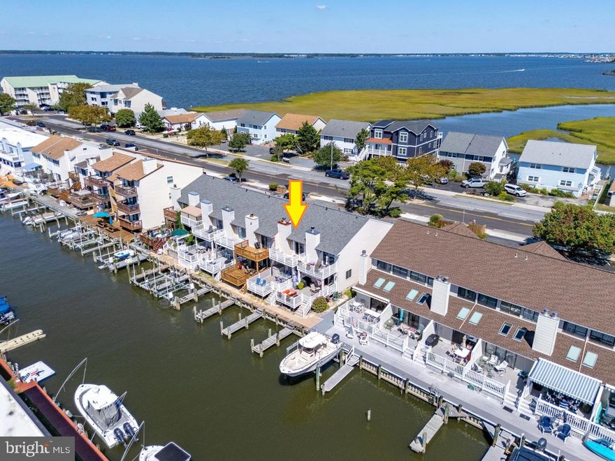 WATERFRONT TOWNHOUSE - NO CONDO OR HOA FEES - RARE FIND! That's right, never worry about condo fees, HOA fees or ridiculous special assessments!! Enjoy waterfront living and bring the boat or jet skis! You'll love the large rear deck, balcony off the main bedroom, private pier and boat slip! This 2 bedroom, 2.5 bathroom townhome conveys fully furished and has plenty of space with an open floor plan. Stay warm in the offseason months with the woodburning fireplace in the living room. Recent improvements include: The roof was replaced in 2024, the bulkhead and both sliding glass doors were replaced in 2022. The hot water heater, washer and dryer were replaced in 2021. Property is sold as is. Repeat....this is NOT a condo. You never have to worry about condo fees, HOA fees or those costly special assessments!! Schedule a showing to see this great home in the sought after 94th St. corridor - you can't beat this location!