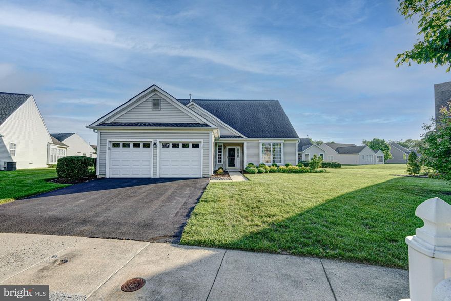 Welcome to 107 Dawn Ct, a beautifully maintained home in the sought-after 55+ community of Spring Mill in the heart of Middletown where exceptional value, low-maintenance living, and a true sense of community come together. From the moment you arrive, the home’s stunning curb appeal shines with well kept landscaping, a welcoming exterior, and a spacious two-car garage that immediately sets the tone for what’s inside. Step through the front door into a bright and inviting foyer flanked by a formal living room and private office, where hardwood flooring  continues throughout the main living space. The expansive family room offers the perfect place to gather, flowing seamlessly into the oversized eat-in kitchen complete with abundant cabinetry, generous prep space, and a peninsula with additional seating ideal for casual dining or entertaining guests. Just beyond, the sunroom extension glows with natural light and creates the perfect spot to enjoy morning coffee, quiet evenings, or views of the private rear porch and backyard. Just off the kitchen, the laundry space leads to the two-car garage. The thoughtfully designed layout continues with a spacious primary suite featuring its own private bath with double vanity and walk-in shower, while a second generously sized bedroom sits conveniently beside a full hall bath  perfect for overnight guests or visiting family. Upstairs, the large loft provides an incredible bonus space that can easily function as a game room, den, hobby area, or additional hosting space when entertaining. What truly makes this home stand out is the incredible opportunity it offers to enjoy space, functionality, and lifestyle at an unbeatable value within one of Middletown’s most beloved active adult communities. Residents of Spring Mill enjoy a close-knit neighborhood atmosphere paired with outstanding amenities including low-maintenance lawn care, a clubhouse with fitness center, outdoor pool, and sports courts, all just minutes from local shopping, restaurants, medical facilities, and major roadways including Route 1 and Route 301 for easy commuting and travel. Homes offering this combination of size, features, location, and value do not come along often. Don’t miss your opportunity to become part of this vibrant community.