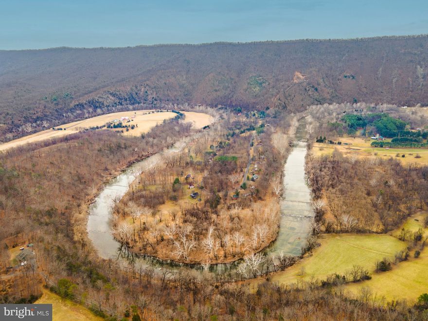 Stunning 7.9 acre hillside homesite. Elevated and wooded, the property offers sweeping mountain views and direct frontage on the Shenandoah River—an ideal setting for a dream home, cabin, or recreational retreat.
Unrestricted land gives you the freedom to build or use the property your way, with septic approval (easement on neighbors property) already in place to simplify your plans. Abundant wildlife, mature trees, and natural beauty surround you, creating a peaceful escape while still offering convenient road frontage for easy access.   Check out the listing of adjoining parcel for sale(MLS#  VASH2013384) a level homesite with well & septic installed.