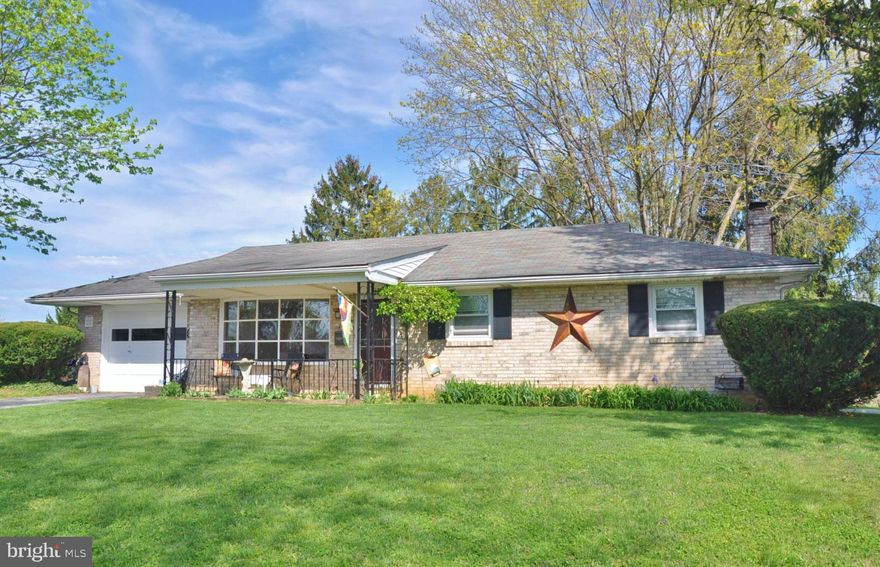 Set on a quiet street just outside of Glen Rock, this move-in-ready three-bedroom brick rancher offers the kind of setting and layout that continues to stand the test of time. Built in 1967, it reflects the solid construction and straightforward design buyers appreciate, paired with updates that make it comfortable for today’s living. A charming covered front porch adds to the curb appeal and gives you a welcoming place to sit and enjoy the surroundings.

Inside, the space feels bright and welcoming, with a large front window bringing in natural light and overlooking a street of well-kept homes. Beautiful wood floors run through the main level, which includes three bedrooms, an updated bath, and a table-space kitchen with updated appliances.  All three bedrooms are currently carpeted, with wood floors underneath.

The lower level expands the living space in a meaningful way, offering a comfortable family room with a fireplace, a separate dedicated laundry room, and a large open area currently set up with a pool table. This space gives you flexibility for recreation, hobbies, storage, or the potential to create additional finished rooms over time.

Central air, replacement windows, and a newer gas furnace add to the overall comfort and efficiency.

Out back, the composite deck overlooks a yard designed to be enjoyed, featuring a two year old above-ground pool with a 40-year warranty and a fire pit area. With the season getting started, the next owner will have plenty of time to move in and enjoy the pool this summer.

The oversized one-car garage adds everyday convenience with interior access to the house, a second door to the backyard, and pull-down stairs to attic storage, along with a driveway that provides additional parking.

The location ties it all together—just minutes to Shrewsbury, New Freedom, and the Maryland line, with easy access to I-83 for commuting to York or Baltimore. Close to the rail trail, local market, restaurants, and everyday conveniences, while still offering a quiet, settled feel. Located in the Southern School District.

Schedule your private showing or stop by the open house.
