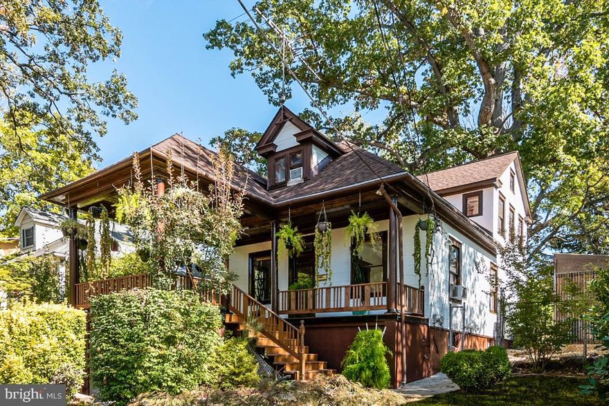 Gardener s Delight in Mount Rainier!  This handsome 5BR/3BA home is move-in ready and has over 2200 square feet of living space!  Gleaming hardwood flooring is found throughout.  Stainless steel appliances, built-in cabinets, a fully finished lower level   oh my!  Enjoy your fall evenings sitting out on the splendid front porch or out in the lovely back yard on large covered deck.  Bring your green thumb alive in the fantastic greenhouse.  All this and conveniently located to shopping and major thoroughfares making your commute a breeze.  Welcome home!