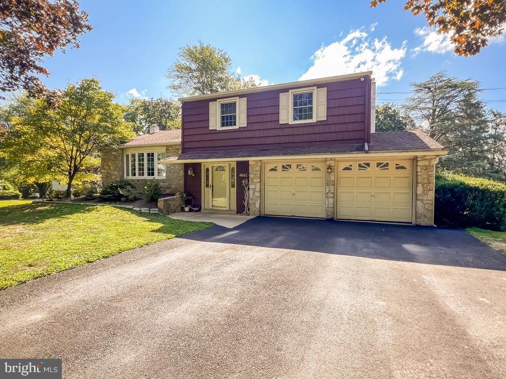 The seller came here for a business opportunity that didn’t pan out so they moved back west. They packed their bags and headed out West. But before they left, the remodeled and upgraded this large split level home into a work of art. Pull up into the driveway and you'll notice the large 2 car garage. Enter the first floor into a large foyer, perfect for those rainy or snowy days so you won't walk on and wet the beautiful hardwood floors. You'll love the large closet, perfect for coats and other storage. Go up a few steps to the left and you'll enjoy plenty of natural light and see the original hardwood floors, remodeled into a luxurious and perfect reminder of quality workmanship. The dining room was opened into the kitchen for an open floor plan. The immaculate clean kitchen has an island breakfast bar, quartz counter tops, soft close drawers, over size custom cabinets, and an inset stainless sink. The beautiful appliances are all less than a year old, as is the Central Air system. Go up to the 3 large bedrooms and ceramic tile hall bath with soaking tub. The master bedroom has a master bath also with ceramic tile. Go down from the kitchen and you'll appreciate the gorgeous gathering room with real wood working fire place. From here you can step out into the brick patio where you can easily add a pergola and enjoy the serenity of a huge yard. Perfect for a pool or even a separate building. You can just make it a fenced in yard and enjoy the space of almost a half acre of flat ground. The entry floor is completed by a powder room, laundry room with steps to the large basement which can be finished for more space. Public records show a smaller sq ft than when measured due to the family room. Back out to the driveway and you'll see it is perfect for parking 4 or more cars or hang a hoop for some basketball. Put your personal touches for the perfect home with room to grow.