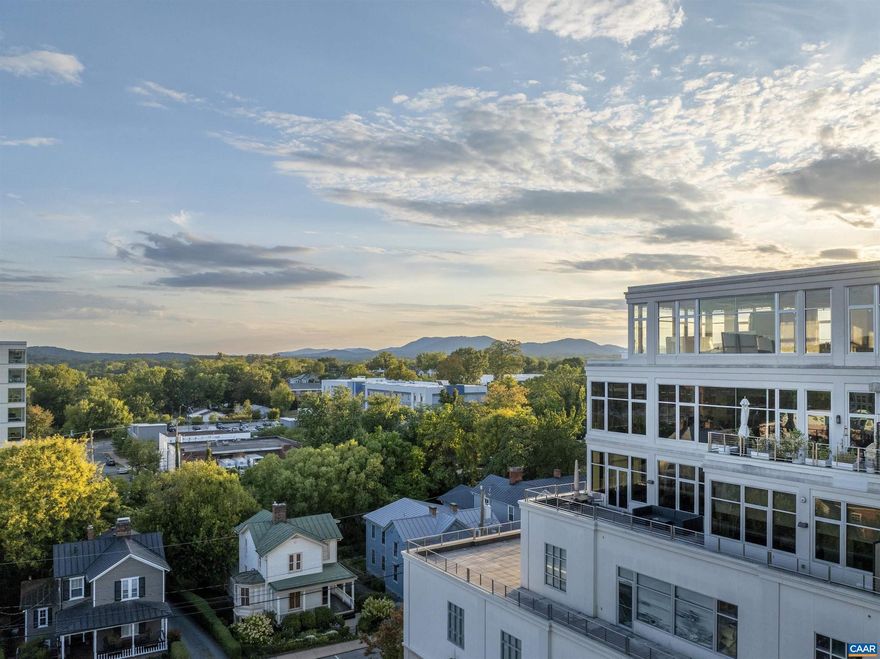 This modern home is an understated jewel offering picturesque views of the city and the surrounding Blue Ridge Mountains from three sides.  An expansive open floor plan is an entertainer?s dream.  The gourmet kitchen features high-end Thermador appliances including an induction cooktop, oven, microwave, fridge, and dual-zone wine fridge.  The large, sleek island provides plenty of space for preparing a meal while conversing with your guests. Enjoy the meal in the dining room area or on the private terrace.   A nearby pantry provides even more space to keep small appliances out of sight and store pantry staples.  Flanking either side of the expansive great room is a large bedroom with en-suite bath.  The primary suite features a sitting area, custom walk-in closet, and ensuite bathroom with floating vanity, deep soaking tub and zero-entry shower area.  The second bedroom also has a custom walk-in closet and large ensuite bathroom with dual vanities.  The shades and lights throughout can be controlled manually or using voice or app commands to set the desired mood for your home.   A large laundry room offers additional storage.  Deeded garage parking and EV charger included.,Painted Cabinets,Quartz Counter