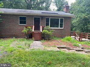 Solid Brick Rambler with 4 bedrooms, 2 full baths located on a private 5+acres lot , Wood Floor, A lot of parking spaces . Lower level with one bedroom and full bath, fireplace and walk-out to backyard. Huge family room. .
