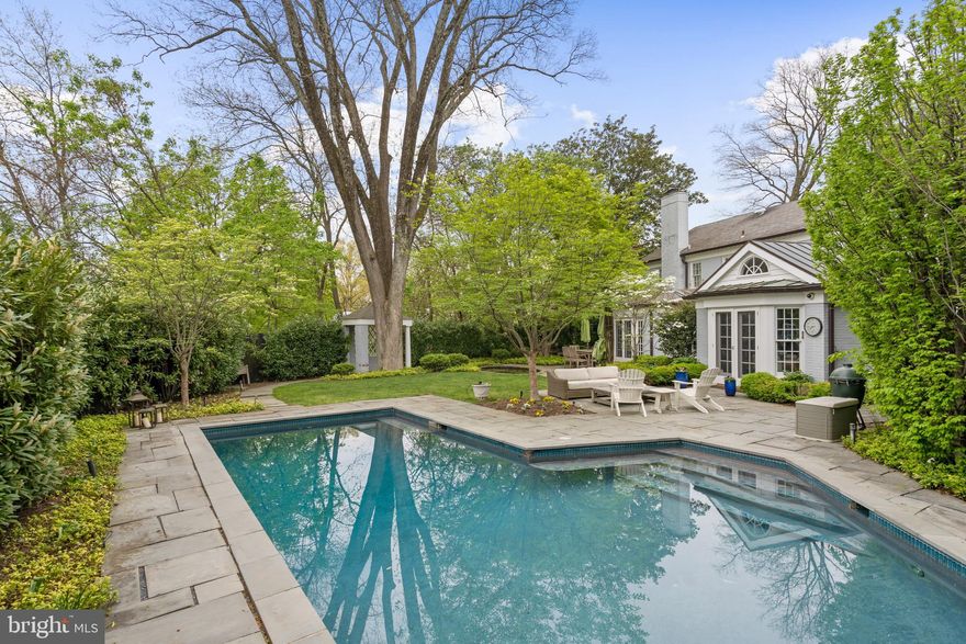 PRICE REDUCED! You are going to fall in love. This beautiful brick colonial sits on a large .38 acre corner lot with a beautiful pool and secluded, lush yard in the heart of Kent. Perfect for entertaining friends and family indoors or out, the home boasts a gorgeous mature garden (irrigation and night lighting) with the (heated) pool and separate koi pond. The gracious living and dining spaces flow onto the back yard patio through french doors. The Chicago brick hallways on the main and lower levels are quite special too.

Upstairs, the primary bedroom is nicely appointed with an attached marble bath and separate shower and nice closet space. Another bedroom upstairs with an ensuite bath boasts a fireplace. Two more bedrooms share the hall bath and there is a bonus attic space for play or a workout/yoga room or art studio. The basement has one more bedroom, a full bath, tons of storage, and a playroom with fireplace. 

You'll also note, the 2 car attached garage and driveway with stone pavers. Sited just 1 mile to shops and restaurants on MacArthur, the location can't be beat. For outdoor fun, note the home is within a mile of Battery Kemble Park, Glover-Archibald dog park, Palisades Rec Center and the Capital Crescent Trail  too. Welcome home!