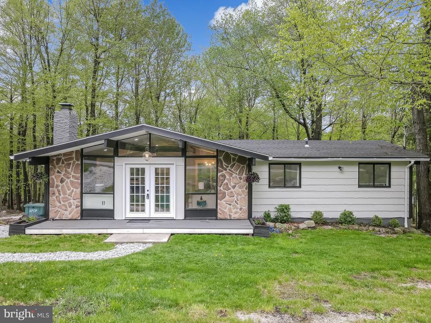 LOCATION! LOCATION! AFFORDABLE LAKE HOUSE ALERT!! JUST STEPS FROM DRESSER LAKE in the amenity filled STR FRIENDLY community of A POCONO COUNTRY PLACE! This completely renovated 3 BEDROOM 2 FULL BATH CONTEMPORARY CHALET TYPE RANCH will knock your socks off with its blend of modern details, and cozy lake chalet flavor, from the open concept main living area with large STONE WOODBURNING FIREPLACE and beautiful light flowing from the CEILING TO FLOOR WINDOWS, WOOD BEAMS overhead to the clean modern lines of the kitchen and bathrooms and modern lighting fixtures! LAKE VIEW from the large back deck, you have access to the lake within a 1 minute walk! THIS IS YOUR NEXT INVESTMENT OR VACATION LAKE HOUSE! ONE FLOOR LIVING! Close to Pocono attractions like Kalahari, Camelback, Mt Airy Casino, Restaurants, Tobyhanna State Park, Outlet Shopping and more! Convenient to highways! LOW LOW TAXES!!