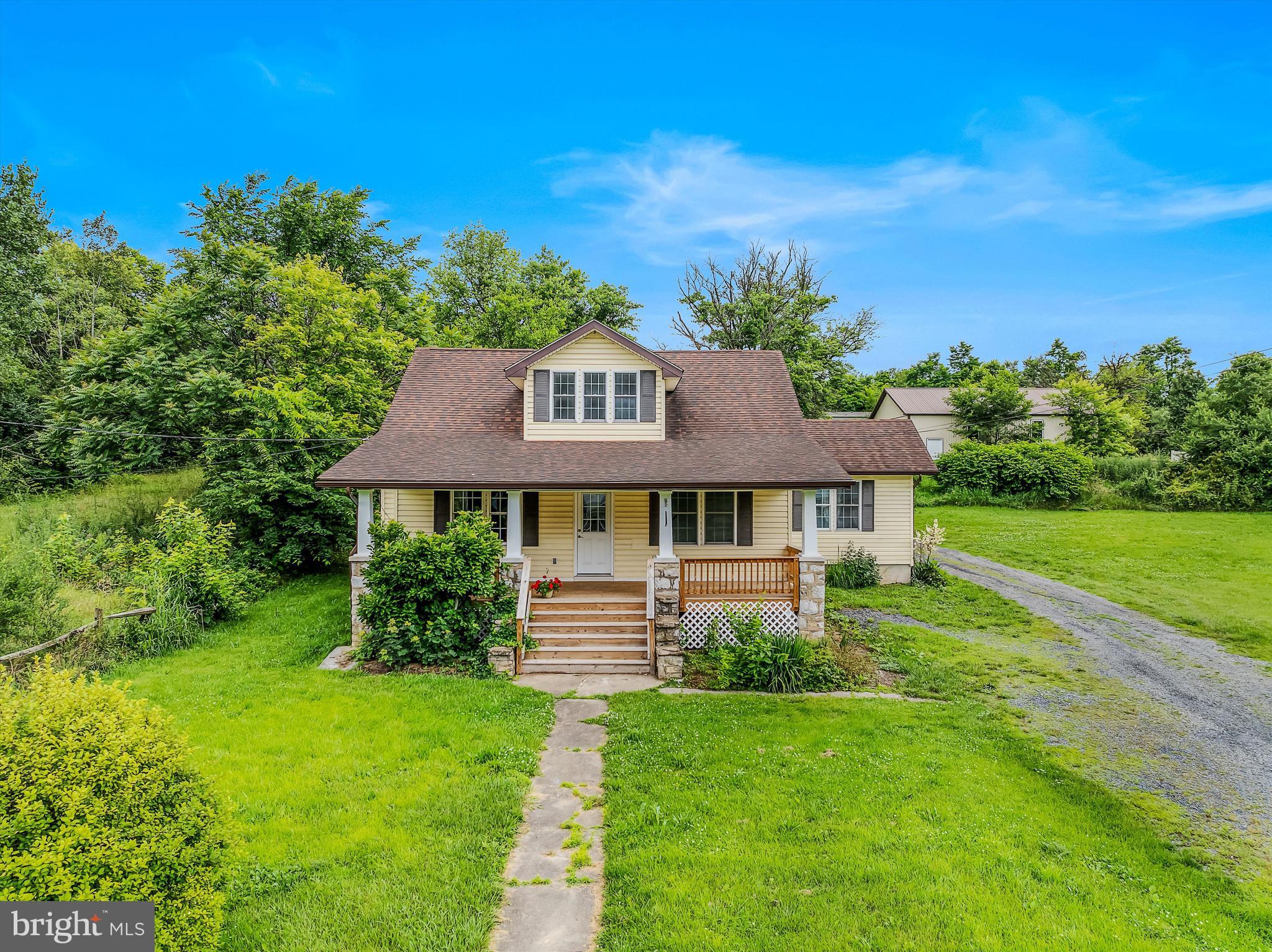 Motivated Seller!! This lovely cape cod home features 5 bedrooms and 2 full baths. The home sits on just under an acre of lush, level land. The land front porch is perfect for enjoying a morning cup of coffee. Inside you have a large living room with LVP floors and overhead lighting. The kitchen was updated last year to include grey shaker cabinetry with soft close, granite countertops, stainless steel appliances and a farm sink. The large laundry/mud room features plenty of room for storage and opens to your rear concrete patio. The main level primary suite features LVP floors, a ceiling, and is complete with a large walk-in closet and private ensuite bathroom. Bedroom 2 is also on the main level, perfect for a nursery or guest room. Upstairs you have 3 more generously sized bedrooms with carpet and overhead lighting. The unfinished basement houses your utilities. Outside you have a detached oversized 1 car garage, would be a great workshop. The detached pole barn measure 30 ft x 40 ft with 2 10 ft x 10 ft doors and 11 ft ceilings. This space has tons of potential. This house has plenty of room for your family inside and out. Schedule your showing today!