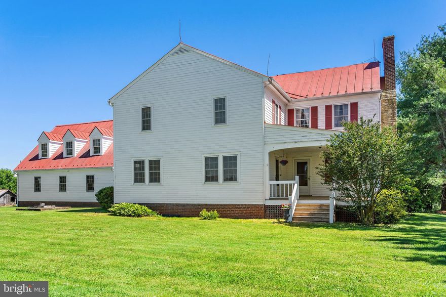 Spring Hill Farm consists of 298 acres of rolling pasture and farmland with Blue Ridge Mountain views.  The driveway winds through the front fields to knoll where the historic farmhouse is located.   Fenced and cross fenced, this farm has been home to cattle and horses for many years. Several streams flow through the farm to Muddy Run, a strong stream that flows through the southern portion of the farm.
   The distinctive white farmhouse with its red roof dates to 1837 and sits on a knoll with Blue Ridge Mountain views. Two additions have been made to the original home, one in 1940 to accommodate a growing farm family and then again in the 1994 updating systems and adding a 3-car garage. Traditional floor plan with living room, dining room, den, kitchen, breakfast room, and full bath on the main level and 3 bedrooms, study, and full bath on the second floor.  Enjoy historic farmhouse charm, with advantage of modern infrastructure.  
   The dependencies reflect a bygone farming era. The old barn that the work horses were kept in, corn crib and a log structure that is thought to be the original homestead, dating to the late 1700âs.  Equipment shed, 5 stall horse barn, shop and large storage barn round out the improvements.